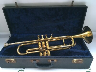 A cased Besson New Creation trumpet.