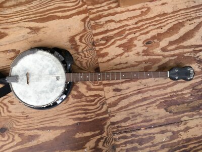 A Grafton four string banjo with original soft carry case.