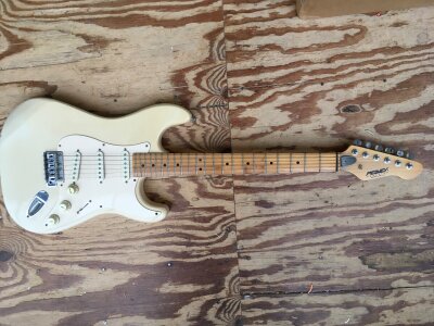 A Peavey Predator electric guitar, no case.