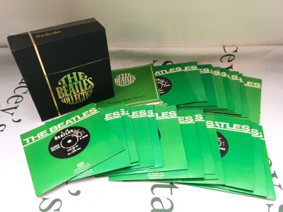 A Beatles Collection 7" singles box set, complete with insert. Damage to box and insert is split in to two pages.