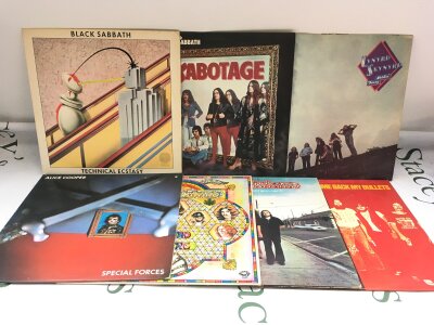 Fourteen rock LPs by various artists including Black Sabbath, Alice Cooper, Lynyrd Skynyrd and others.