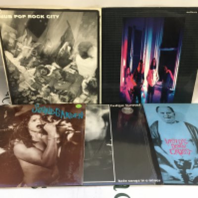 Five grunge LPs and EPs comprising a blue marbled pressing of Screaming Life by Soundgarden, a Sub Pop Rock City compilation, the self titled Mudhoney LP and others. Condition generally EX.