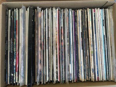 Two boxes containing LPs and 12" singles by various artists including Bob Dylan, David Bowie, Traffic and many more.