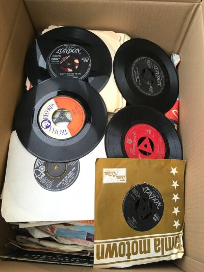 Two boxes of 7" singles and EPS by various artists from the 1950s onwards.