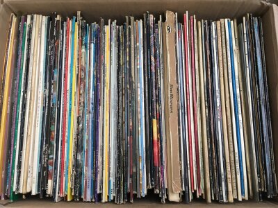 A box and a bag of various LPs and 12" singles by various artists including Marc Bolan, David Bowie, Elton John and others.