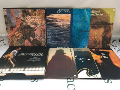 Eight rock LPs by various artists comprising a Bruce Springsteen 5LP box set, Santana, Lou Reed and others.