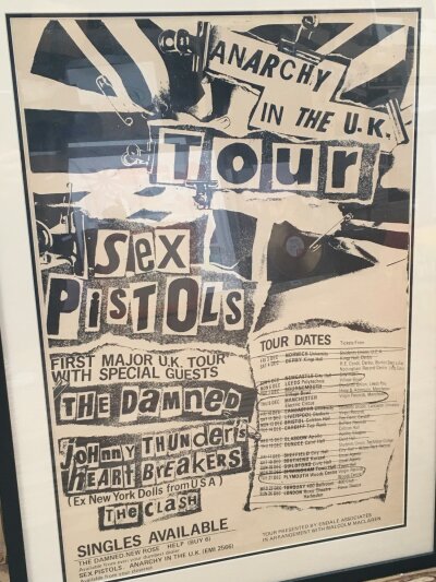 A framed and glazed Sex Pistols poster for the notorious December 1976 UK tour. A vintage reproduction. Approx 63cm x 87cm.