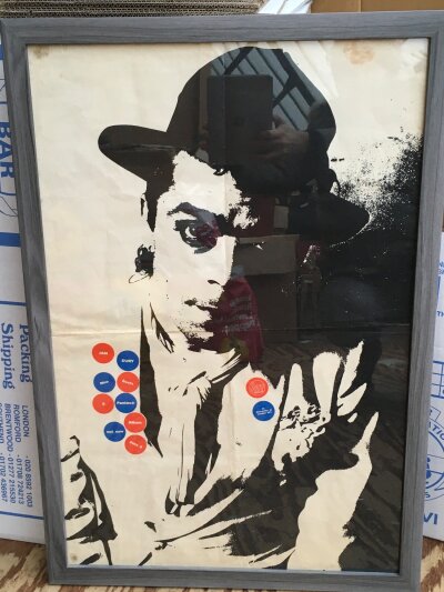 A framed and glazed poster for the Ian Dury album New Boots & Panties, approx 56cm x 82cm.
