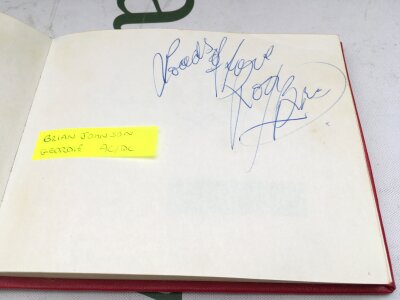 An autograph booklet containing various signatures including Brian Johnson  (AC/DC and Geordie), Labbi Siffre, Suzi Quatro, Bob Monkhouse, Roy Hudd and others.