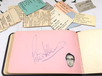 An autograph booklet containing various signatures comprising Peter Sellers, Spike Milligan, Eric Sykes, Benny Hill and others.