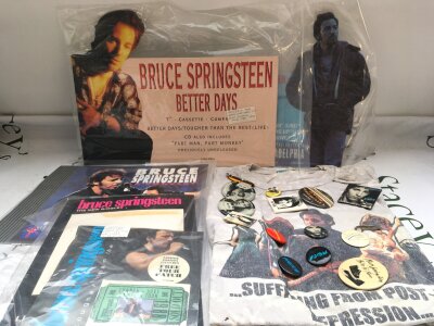 A box of Bruce Springsteen ephemera comprising shop counter displays, badges, t shirt, posters, magazines etc.