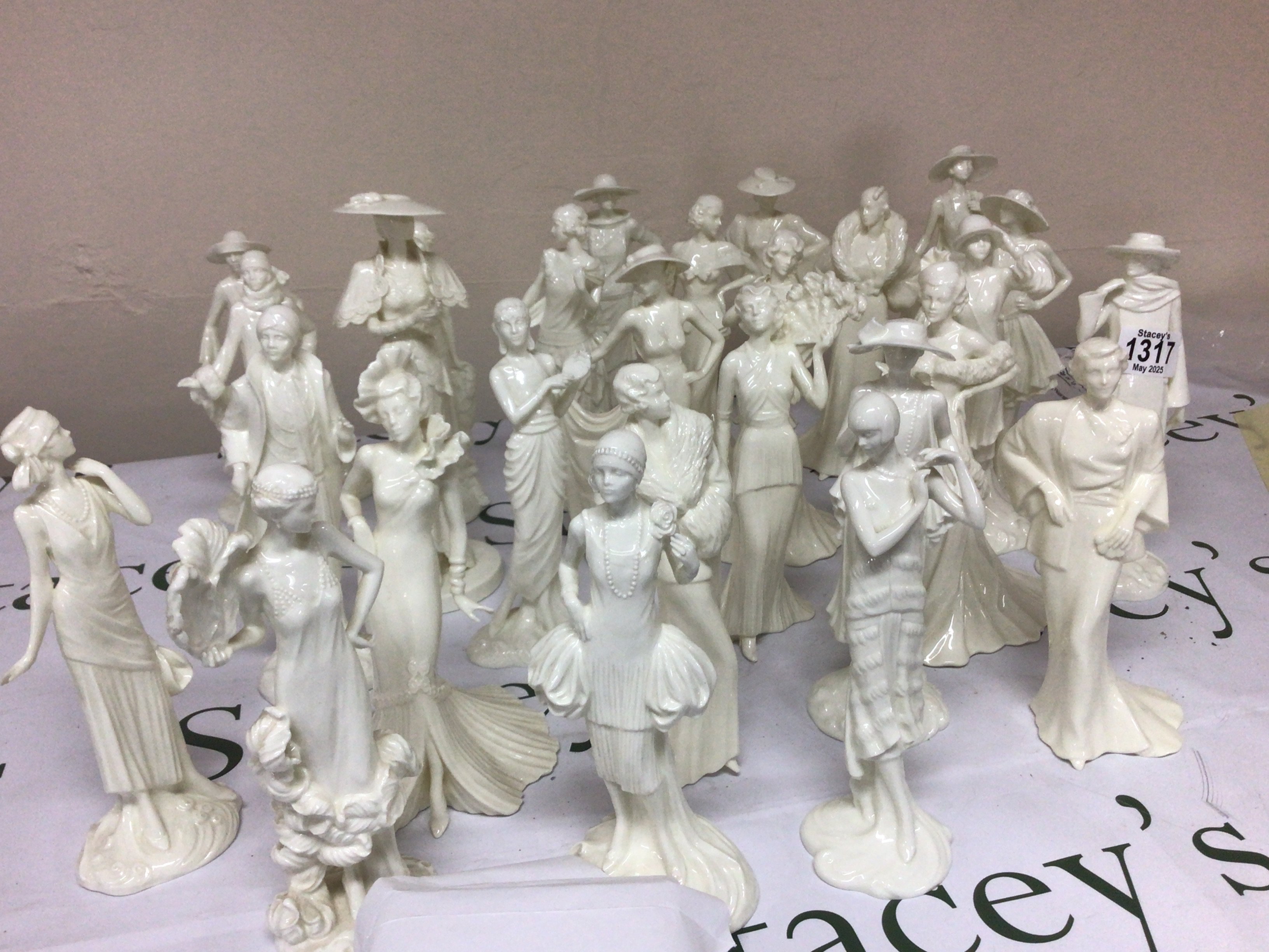 A collection of Worcester and Coalport cream glazed figures The 1920s Vogue collection. Most with certificates of authenticity no obvious damage on this collection.