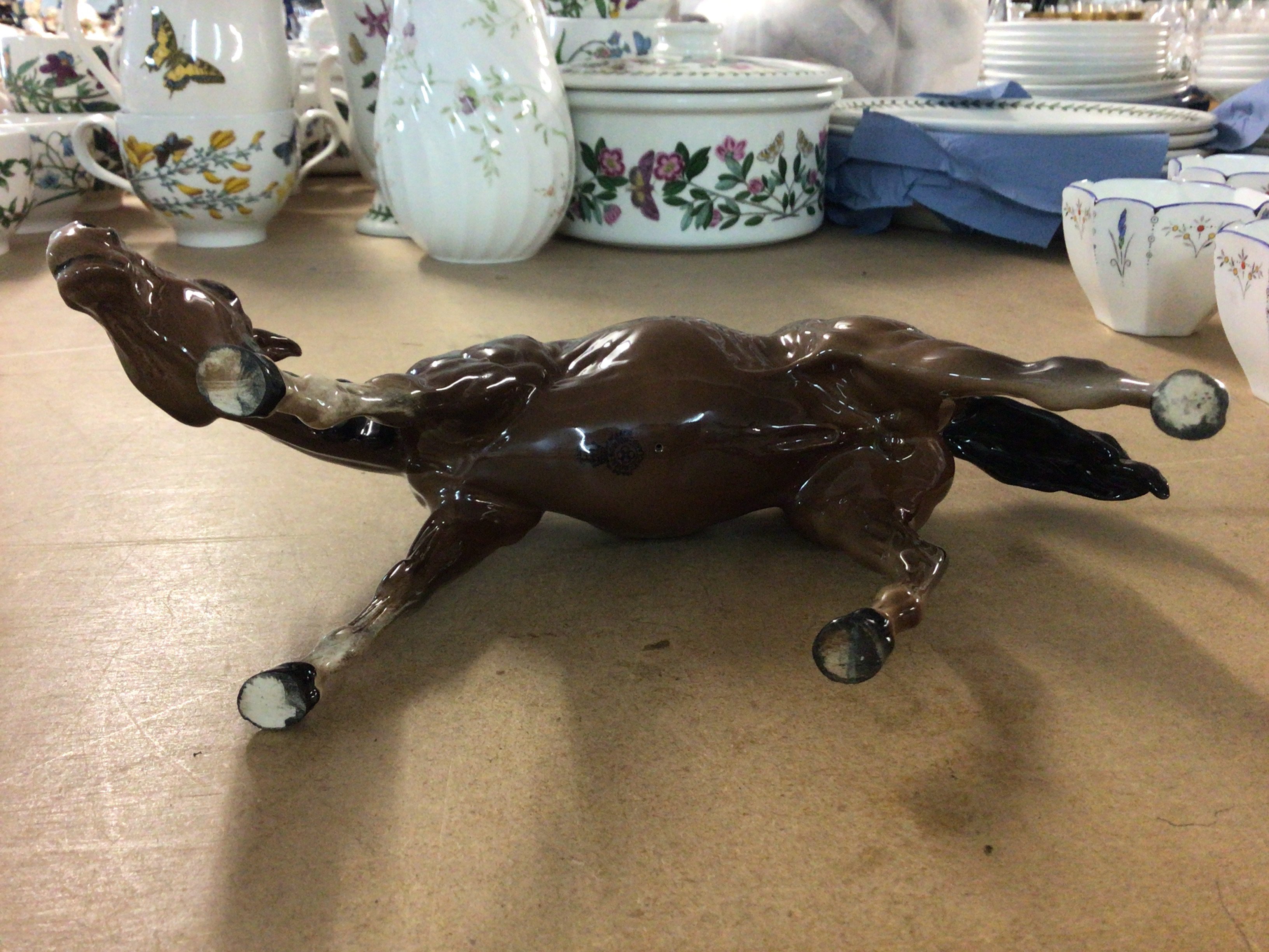 A Royal Doulton horse with its head down. NO RESERVE