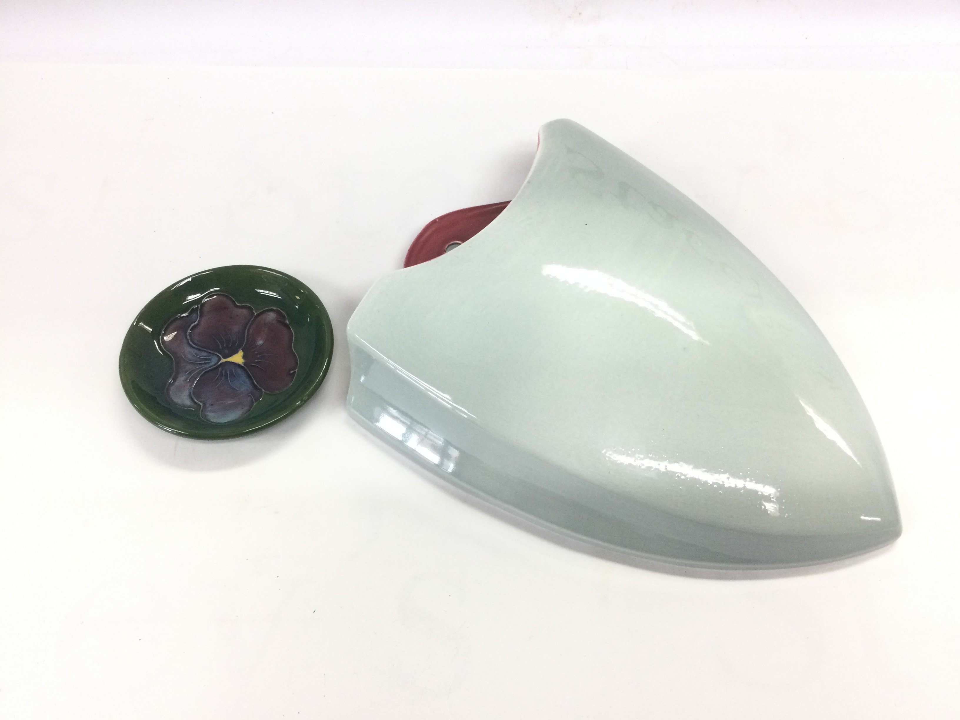 A Moorcroft pin dish and a Sylvac wall pocket (2). Shipping category D.