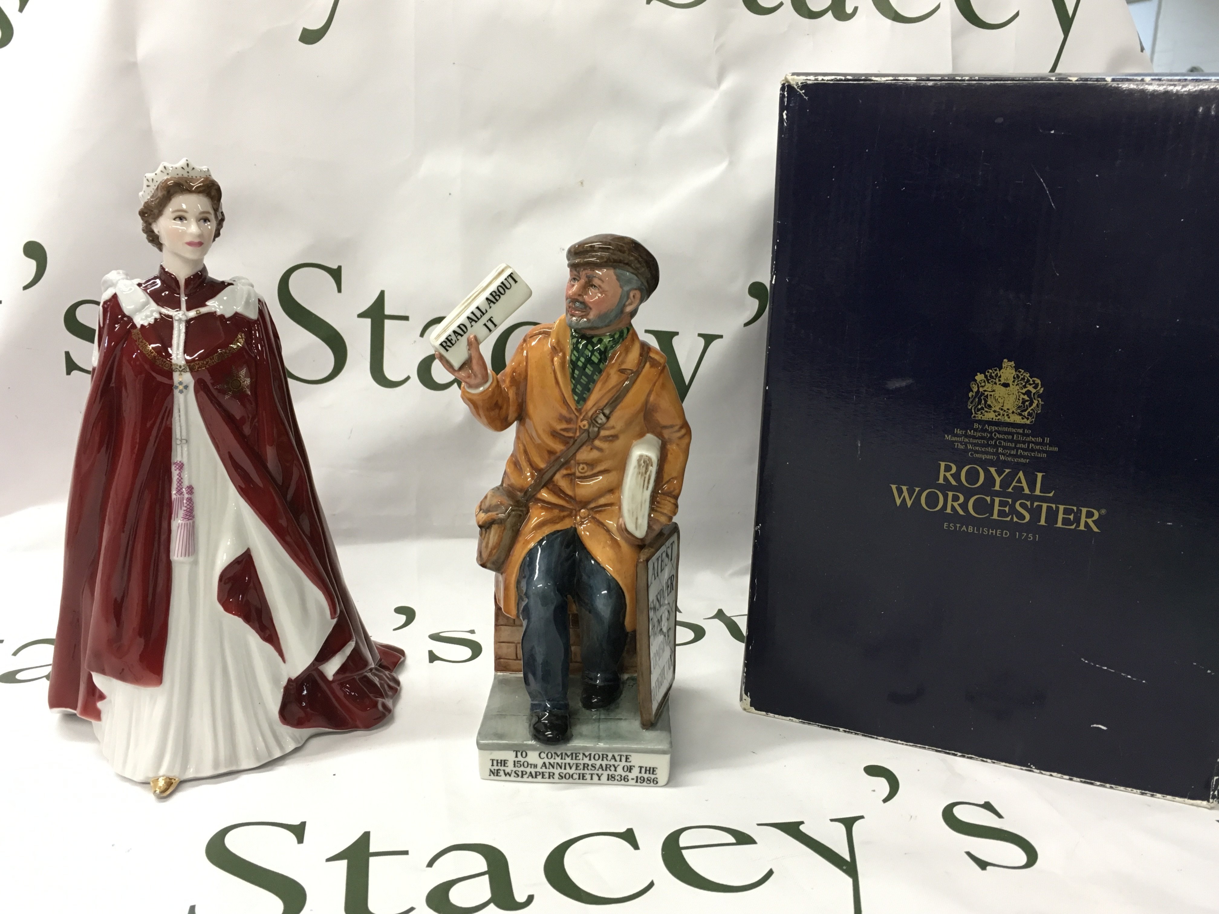 Royal Worcester Queens 80th birthday 2006 figure boxed and a limited edition Royal Doulton Newsvendor figure. No obvious damage or restoration. This lot cannot be posted