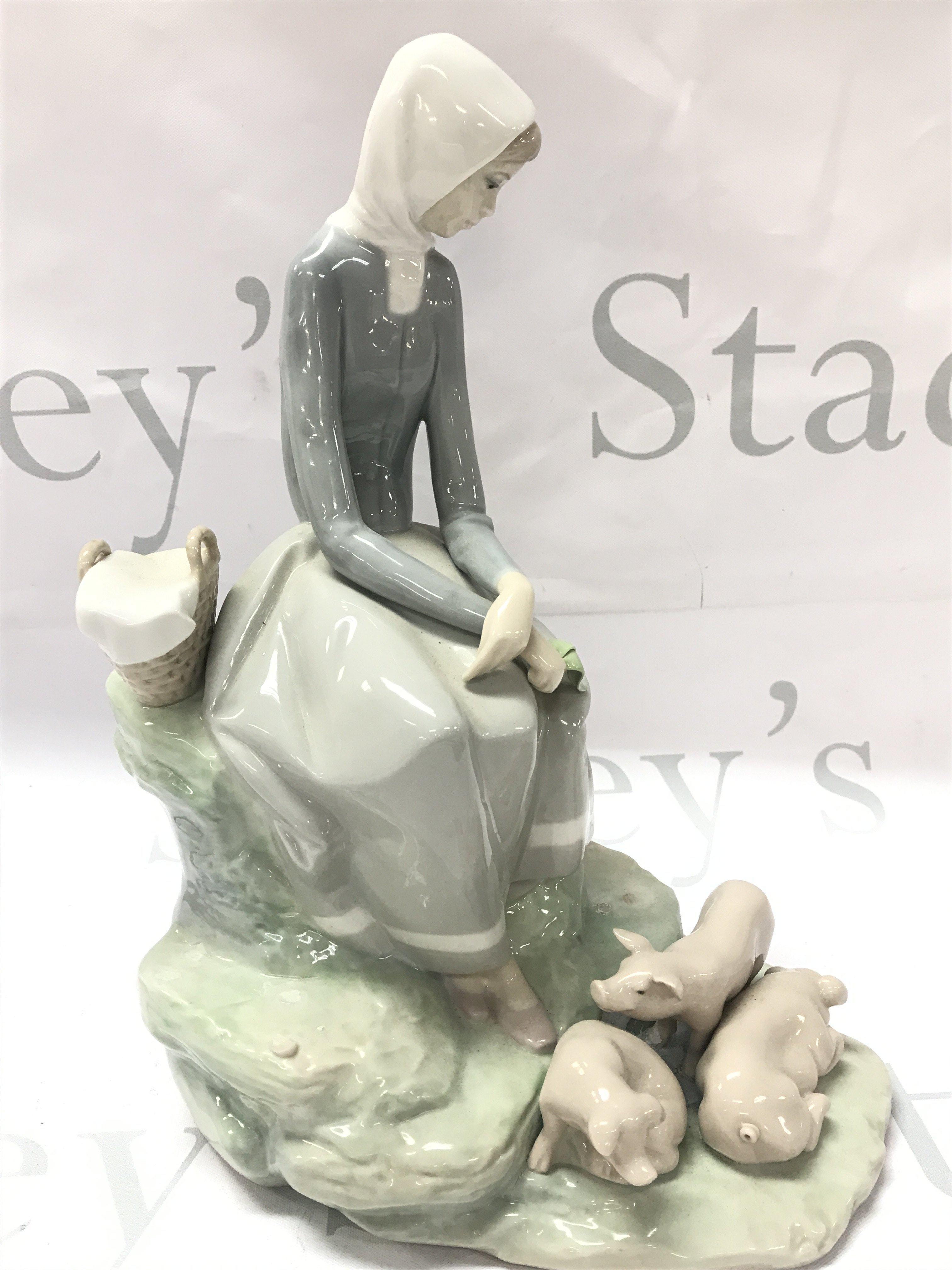 Lladro porcelain figure , girl with geese. This lot cannot be posted
