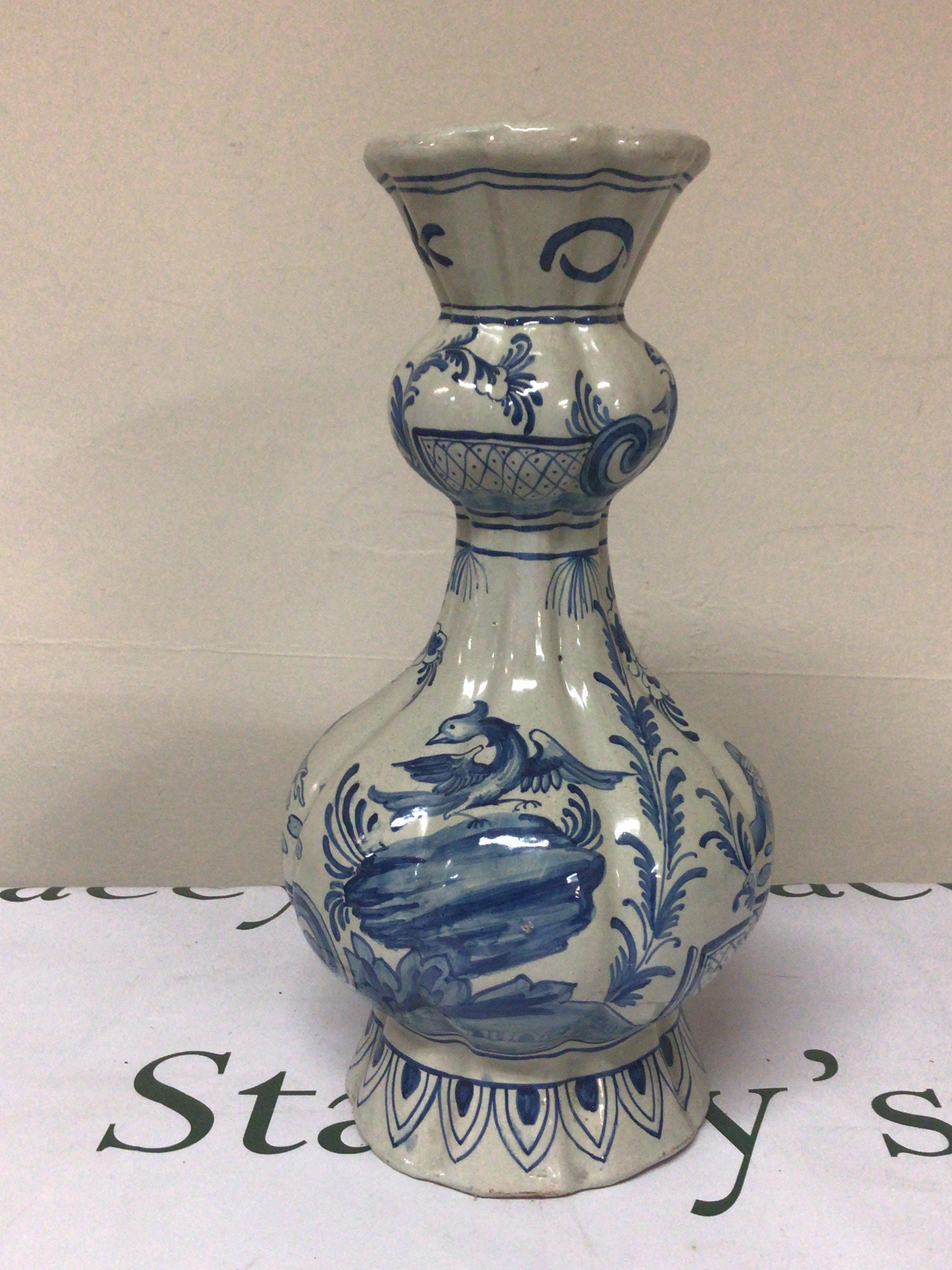 A 19th century Dutch Delft blue and white vase decorated with figures birds and foliage signed base height 33cm. NO RESERVE