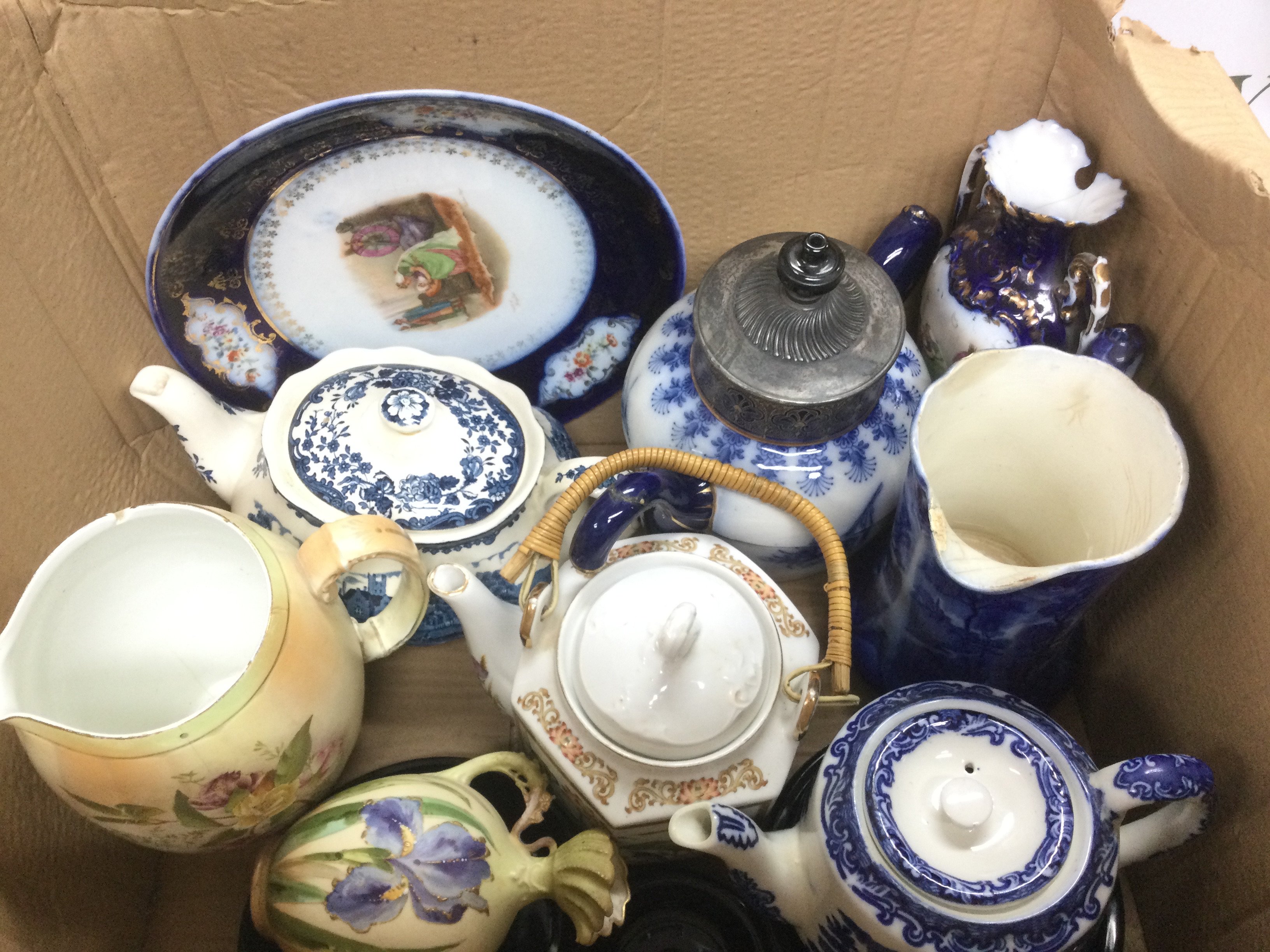 Two boxes of ceramic items comprising mainly blue and white items. Shipping category D.