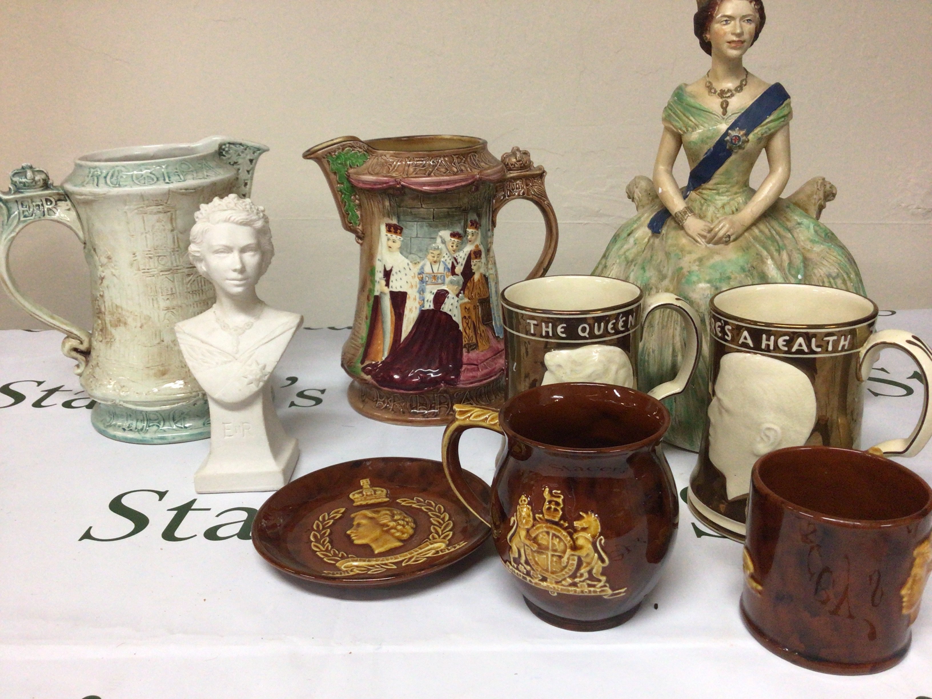 A Burleigh ware commemorative jug the coronation ceremony of Elizabeth II a painted plater figure of Elizabeth II and other conforming ceramics. NO RESERVE.