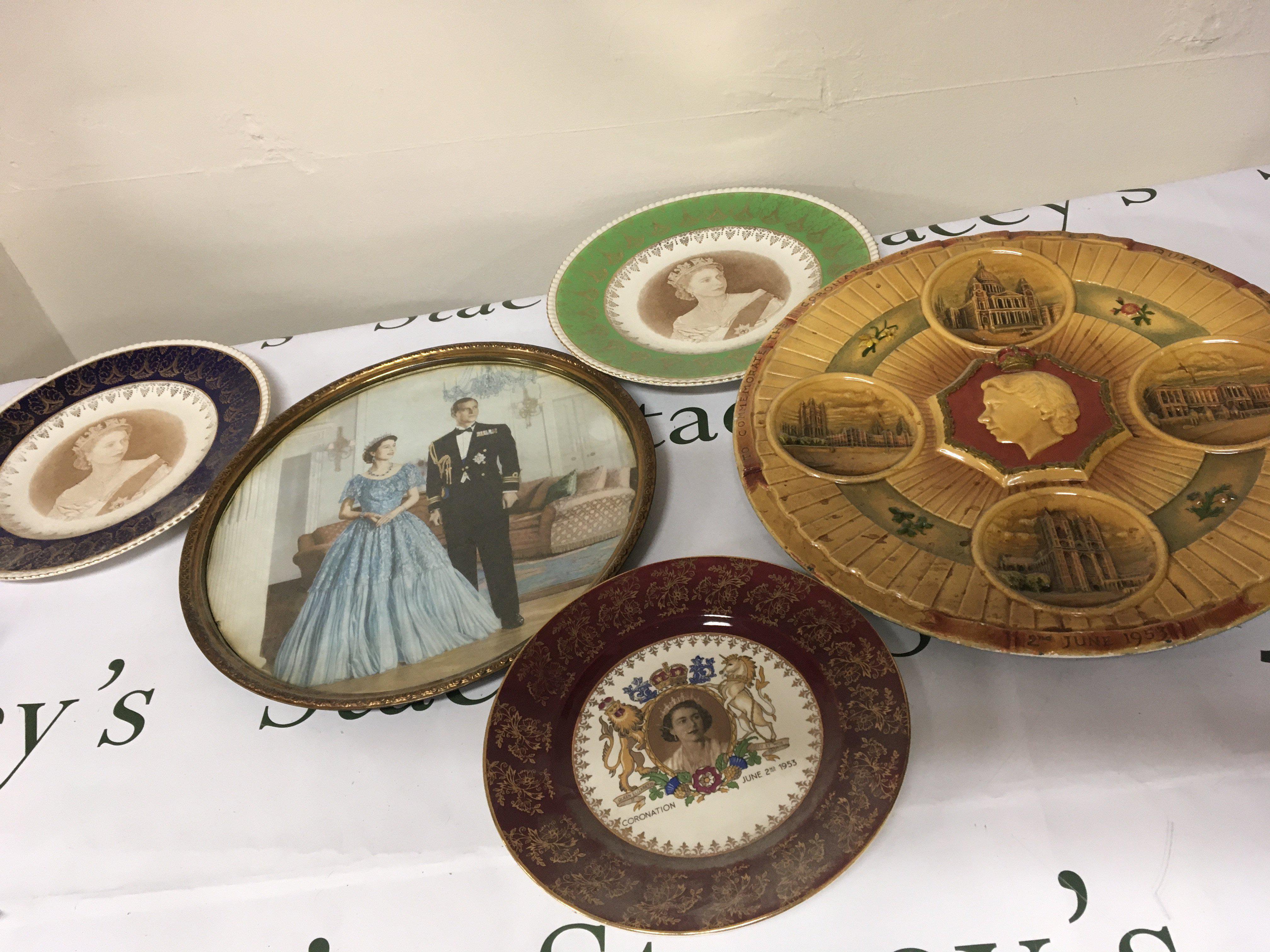 A collection of Elizabeth II Royal Commemorative including a framed image of Elizabeth Il with the Duke a large plaster wall plaque and other plates. NO RESERVE.