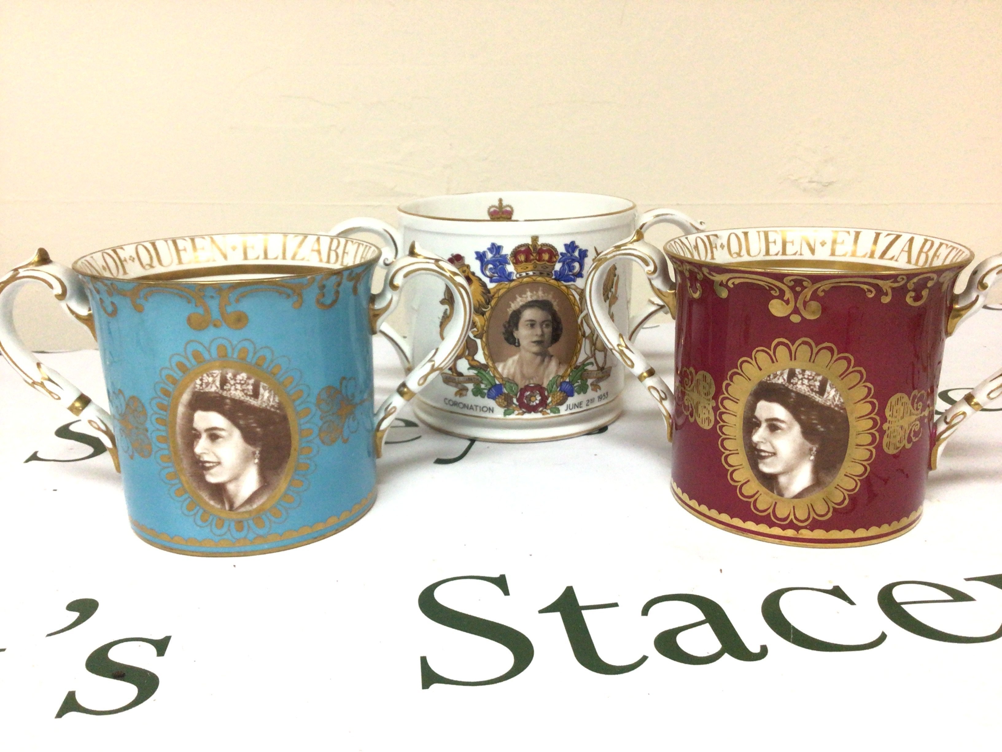 Two Royal Albert Porcelain two handled bone china 1953 Royal Elizabeth II commemorative mugs and Tuscan mug no obvious damage except very minor gilt edge rubbing on the Tuscan mug. NO RESERVE. (3)