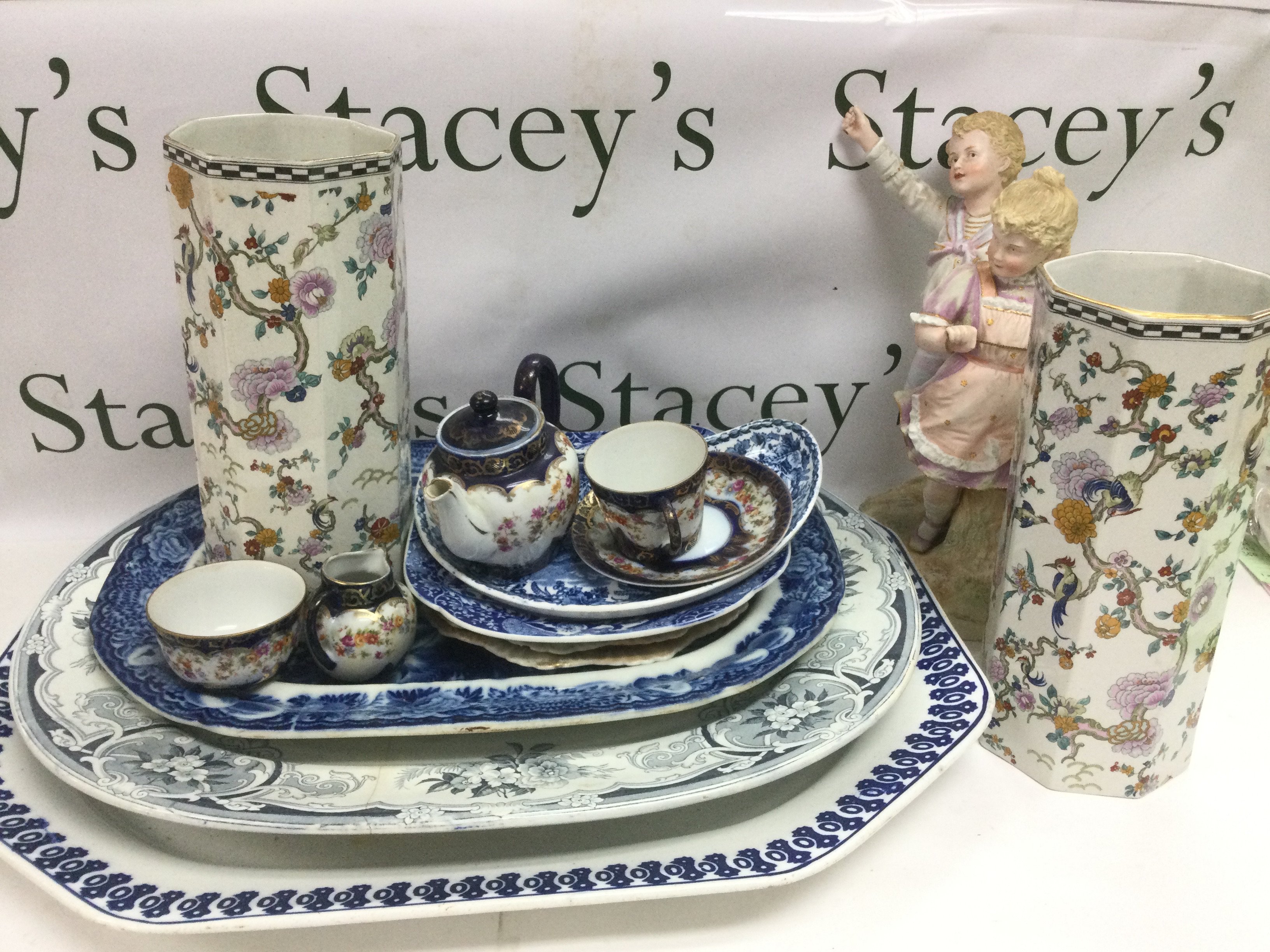 A collection of Victorian meat plates, a bisque figural group, a pair of Wilkinson vases etc. Shipping category D.