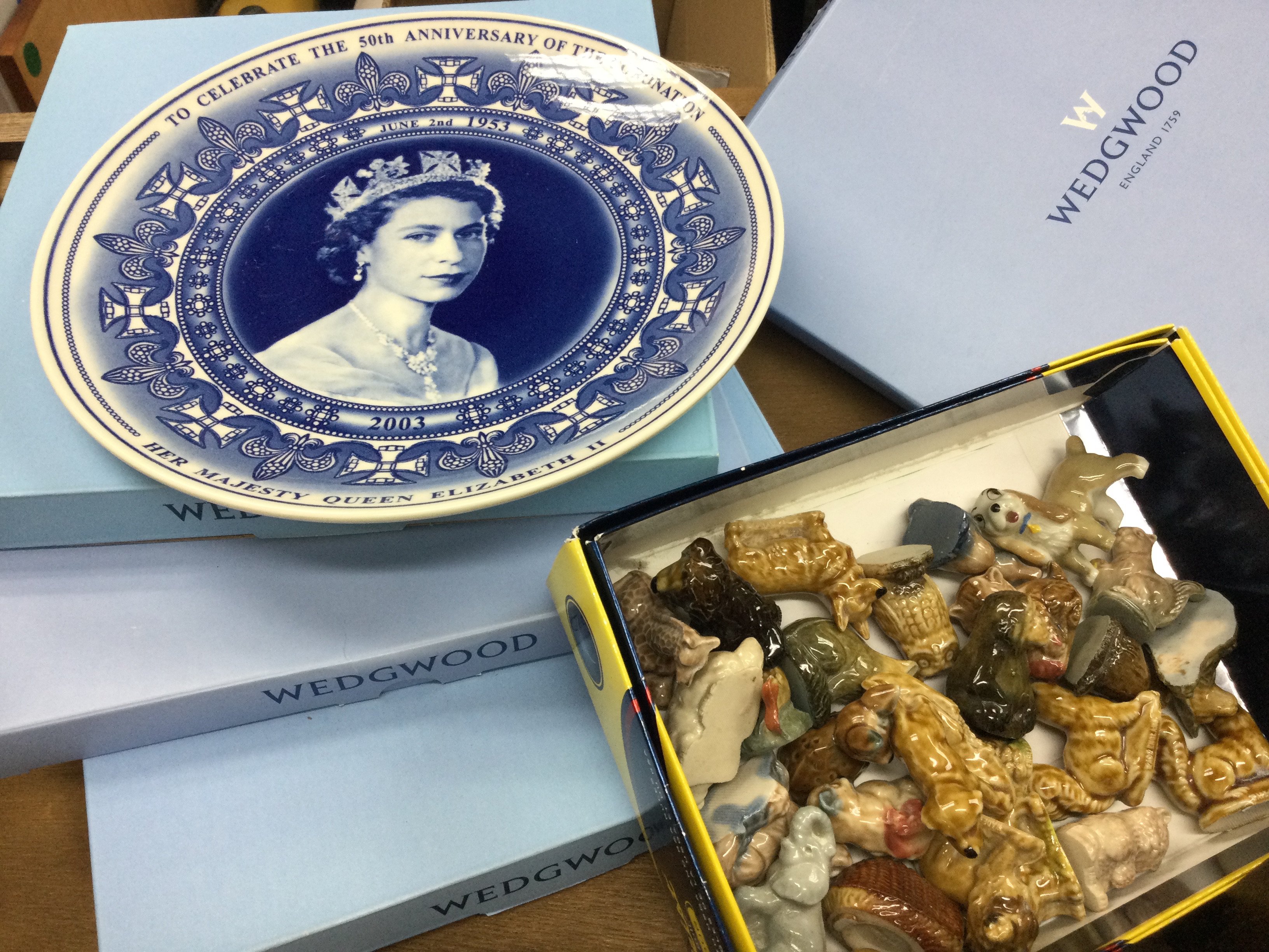 Four Wedgwood commemorative plates and a collection of Wade Whimsies