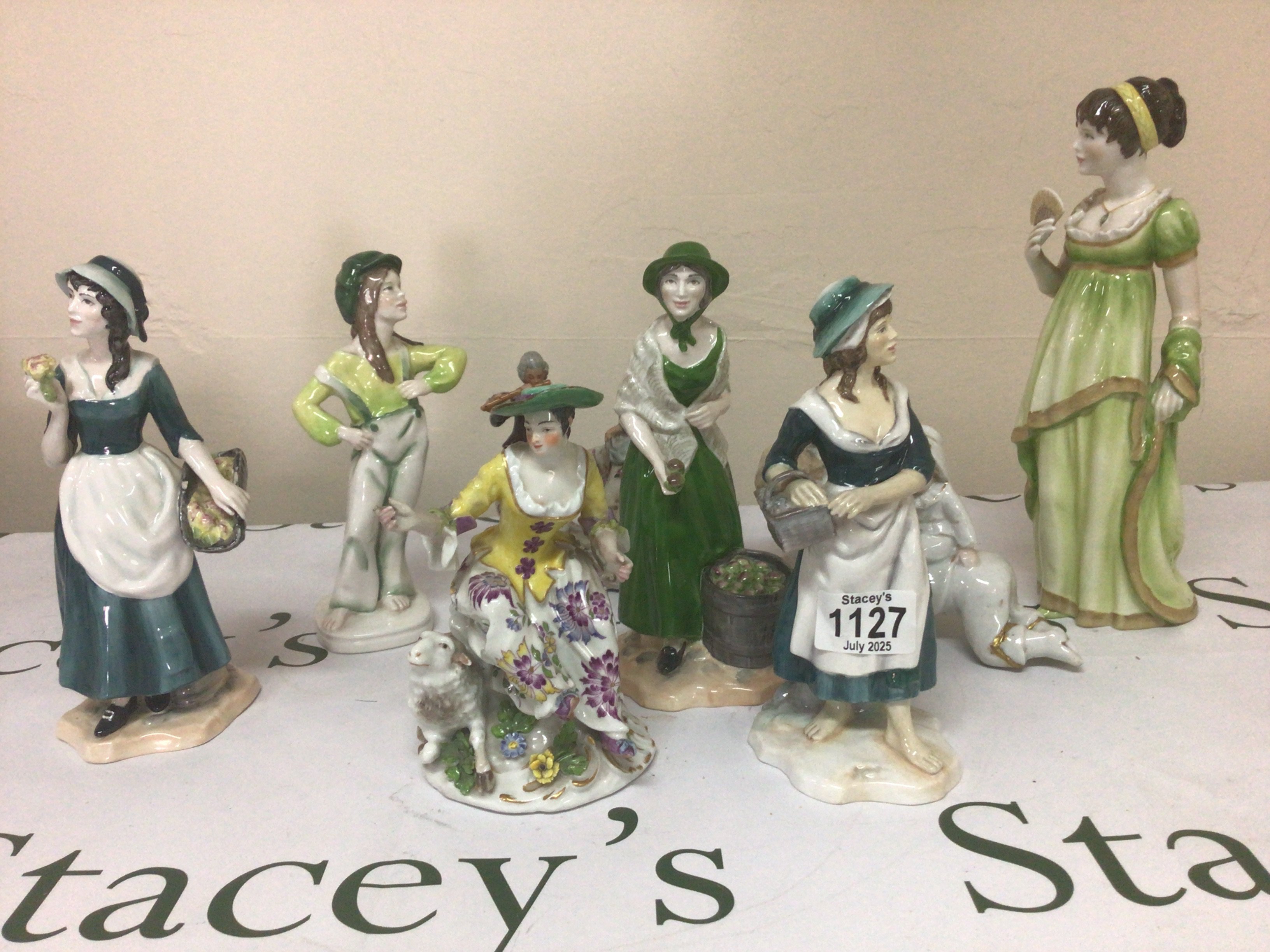 A collection of porcelain figures including an early 19th century figure possibly Chelsea with gold anchor mark and other Victorian and later ceramic figures.