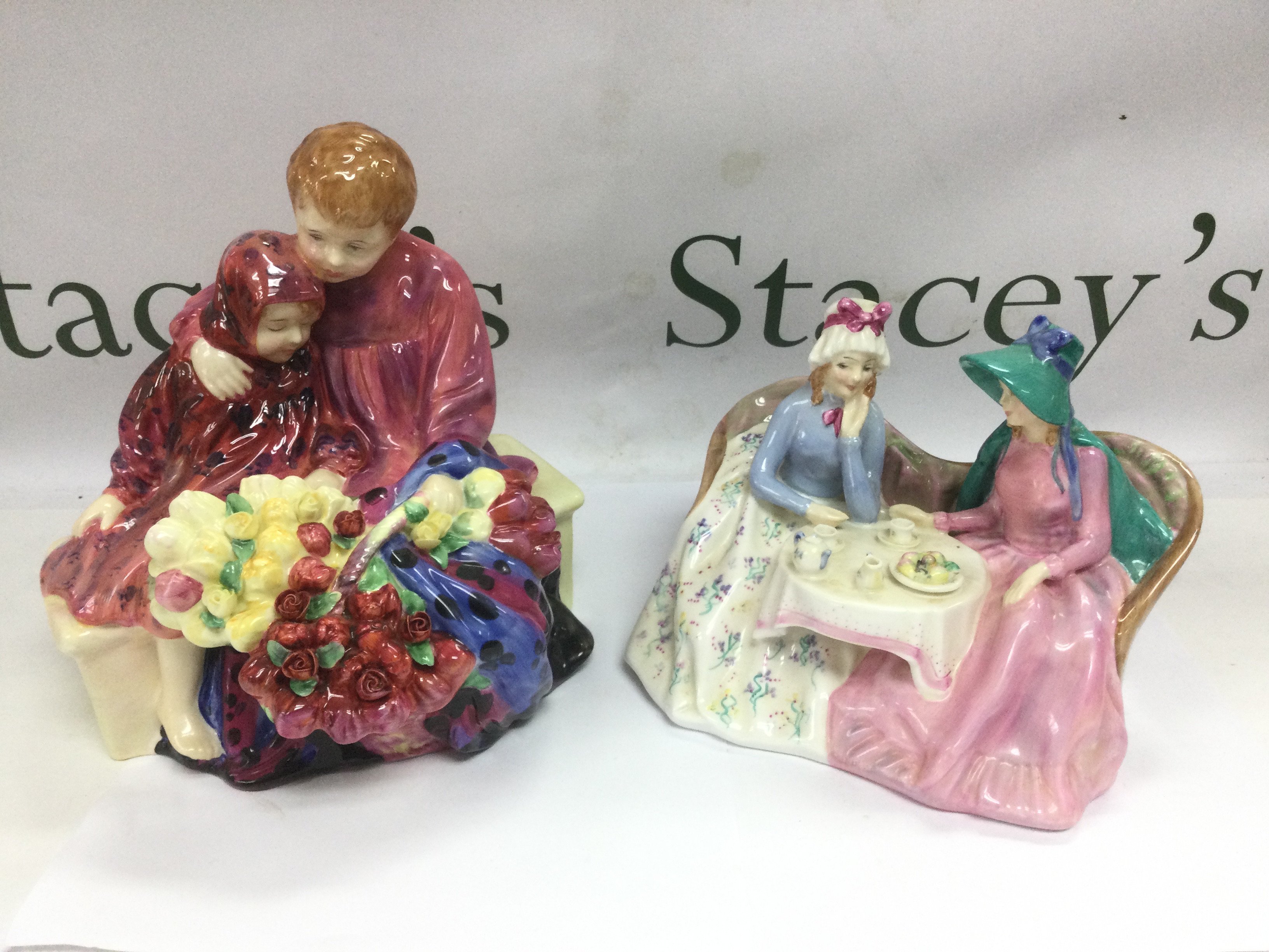 Two Royal Doulton figural groups comprising Flower Sellers Children and Afternoon Tea. Shipping category D.