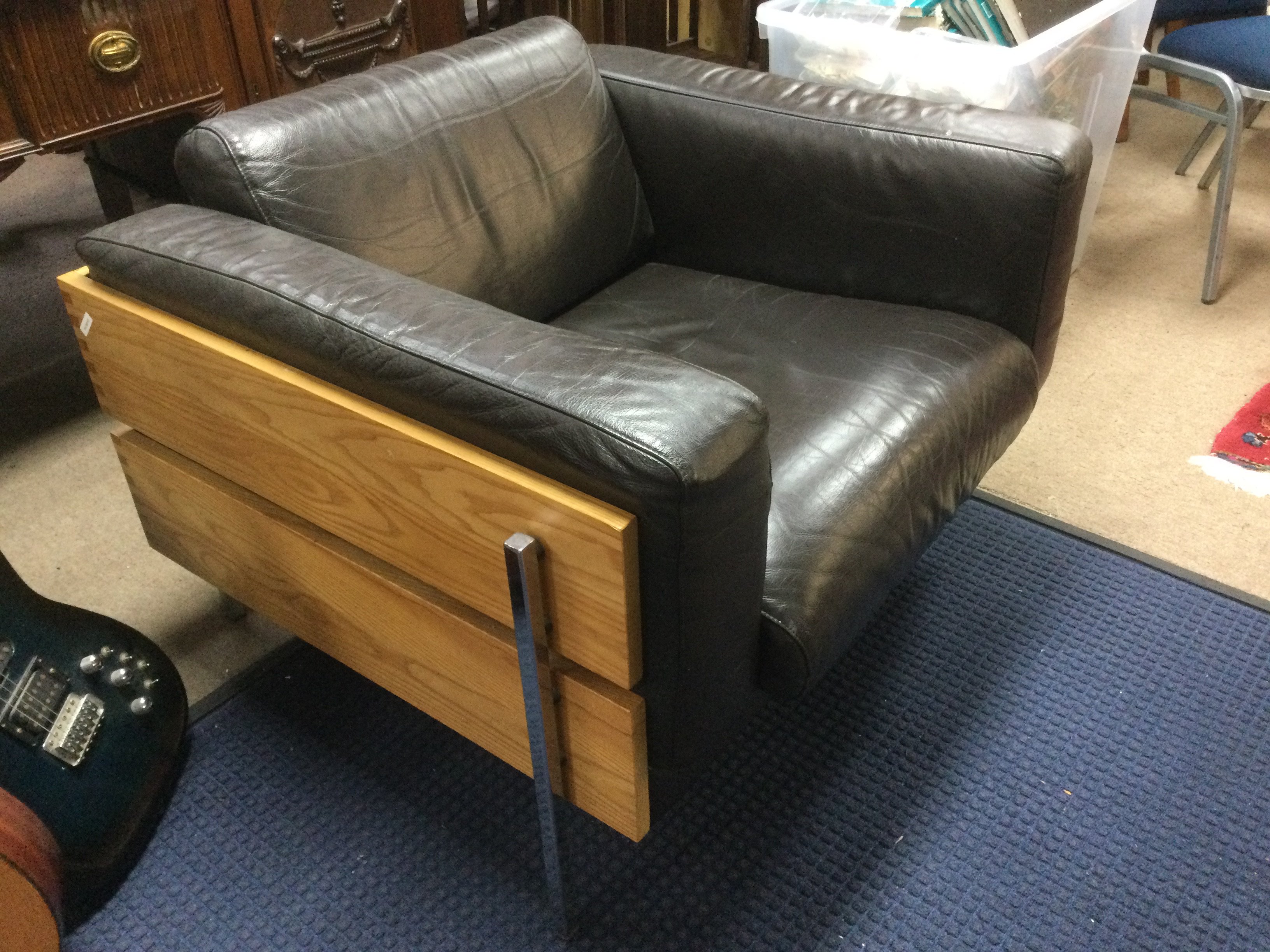 A designer leather chair by Robin Day for Habitat. Shipping category D.