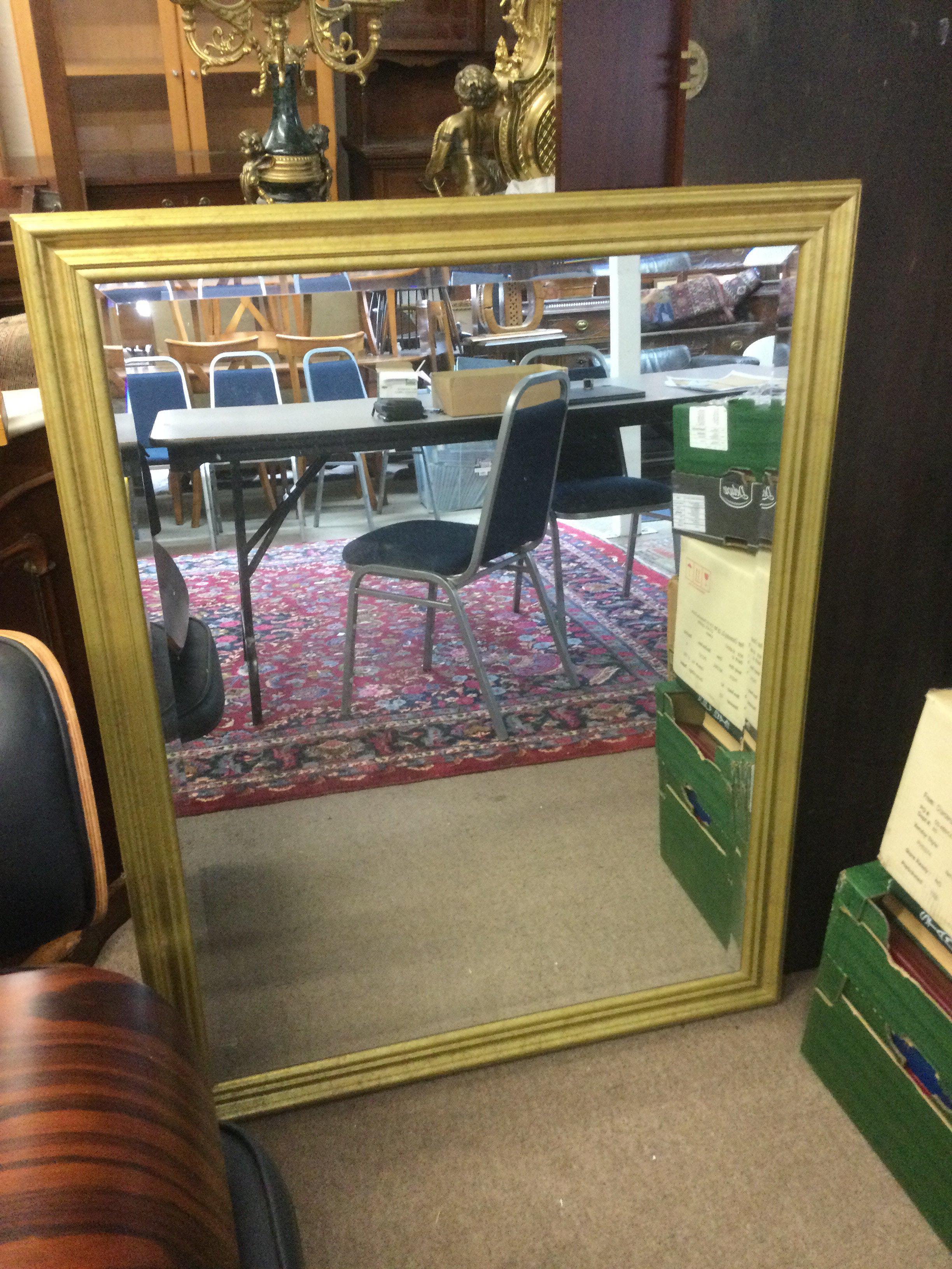 A gilt framed wall mirror, approx 88cm x 114cm. Shipping category D.