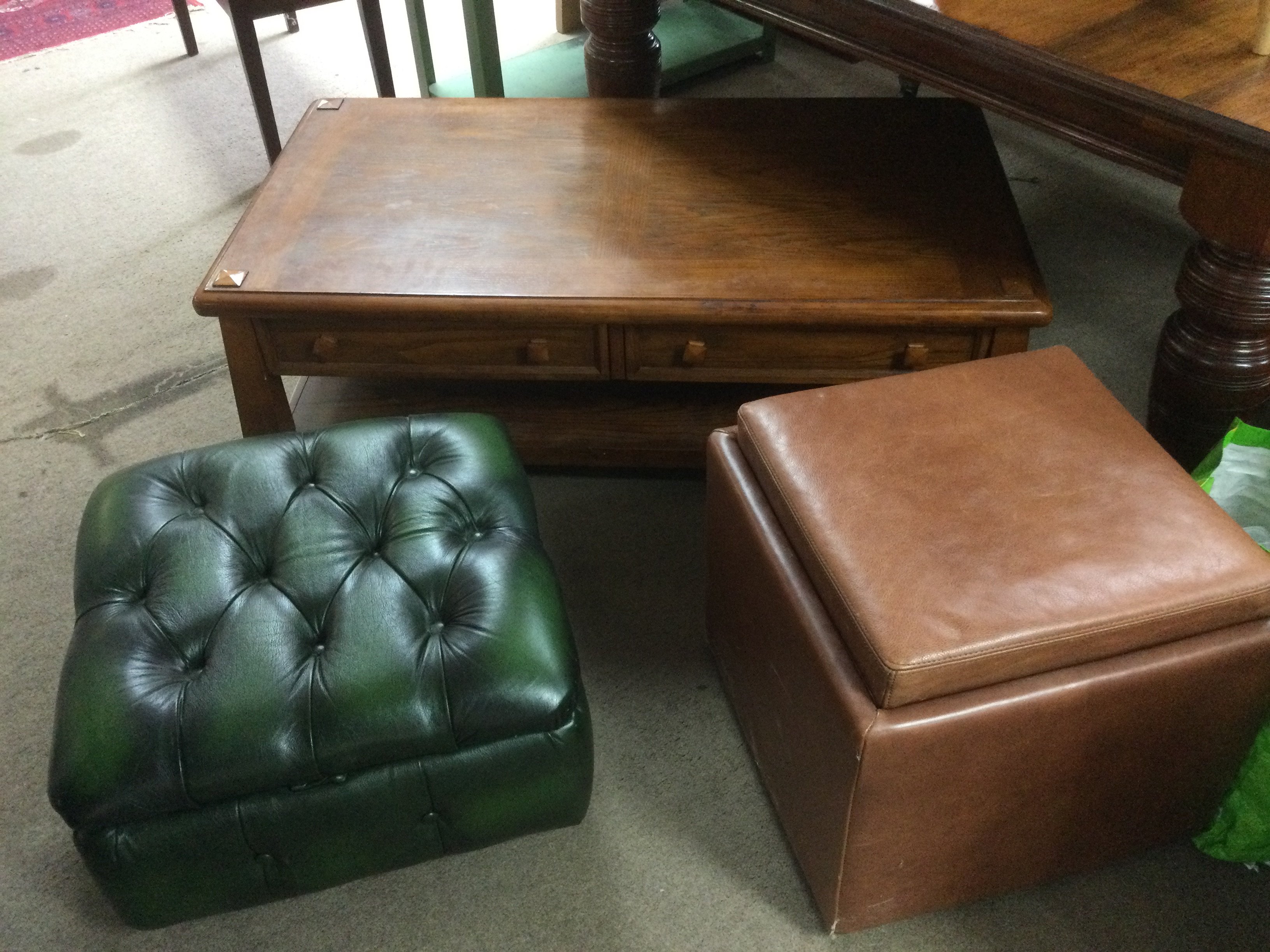 A modern oak coffee table, a tan leather footstool and storage unit plus one other (3).