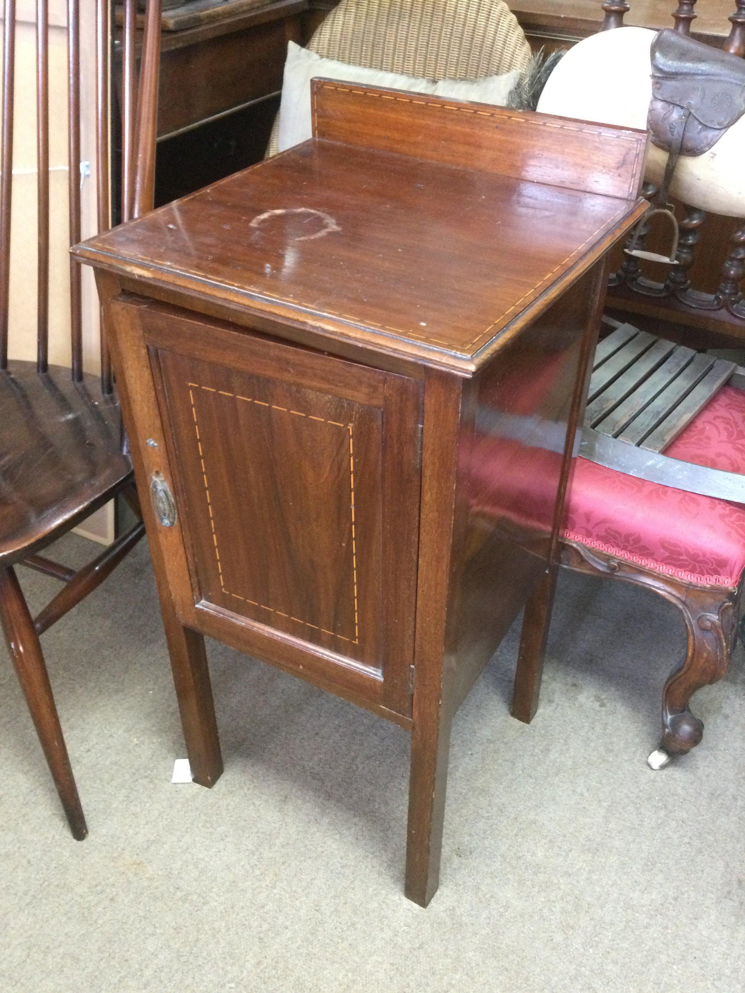 An inlaid mahogany pot cupboard. Shipping category D.