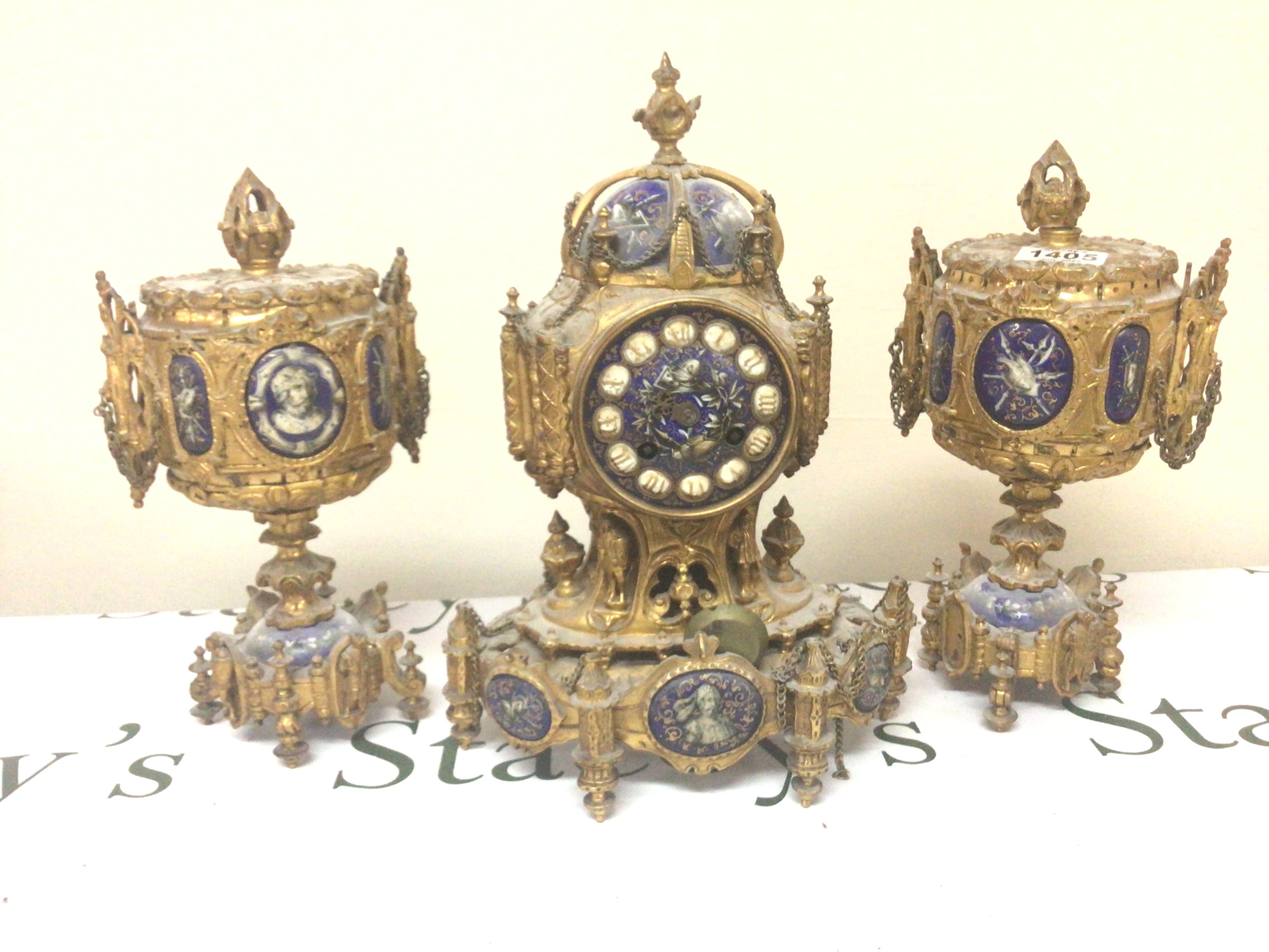 A quality French and enamel late 19th century clock garniture the blue enamel with figures and applied gilt. No pendulum Hight 33cm