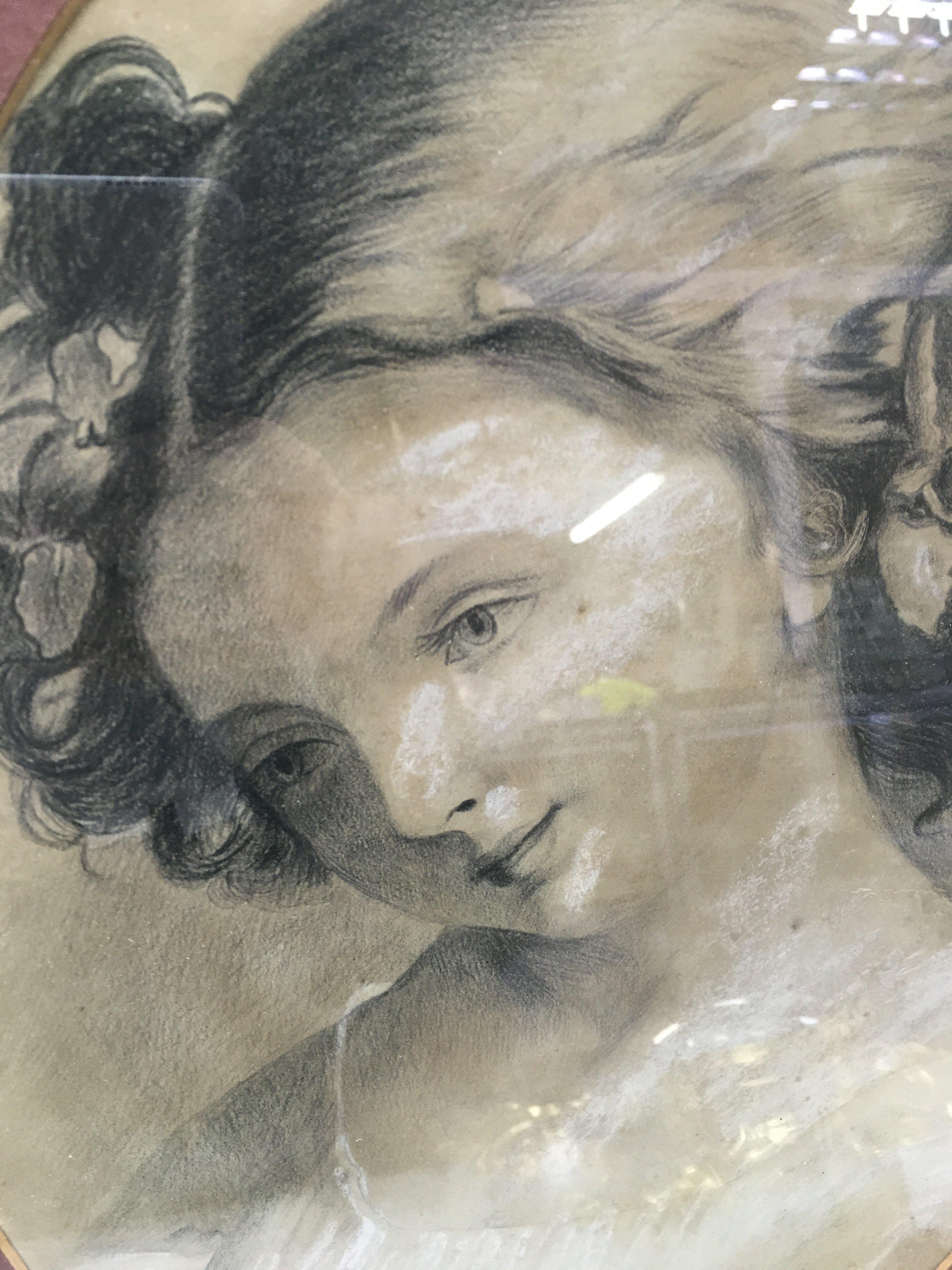 An early 20th century framed chalk and charcoal sketch of a woman . 47cm tall 37cm wide. This lot cannot be posted. NO RESERVE