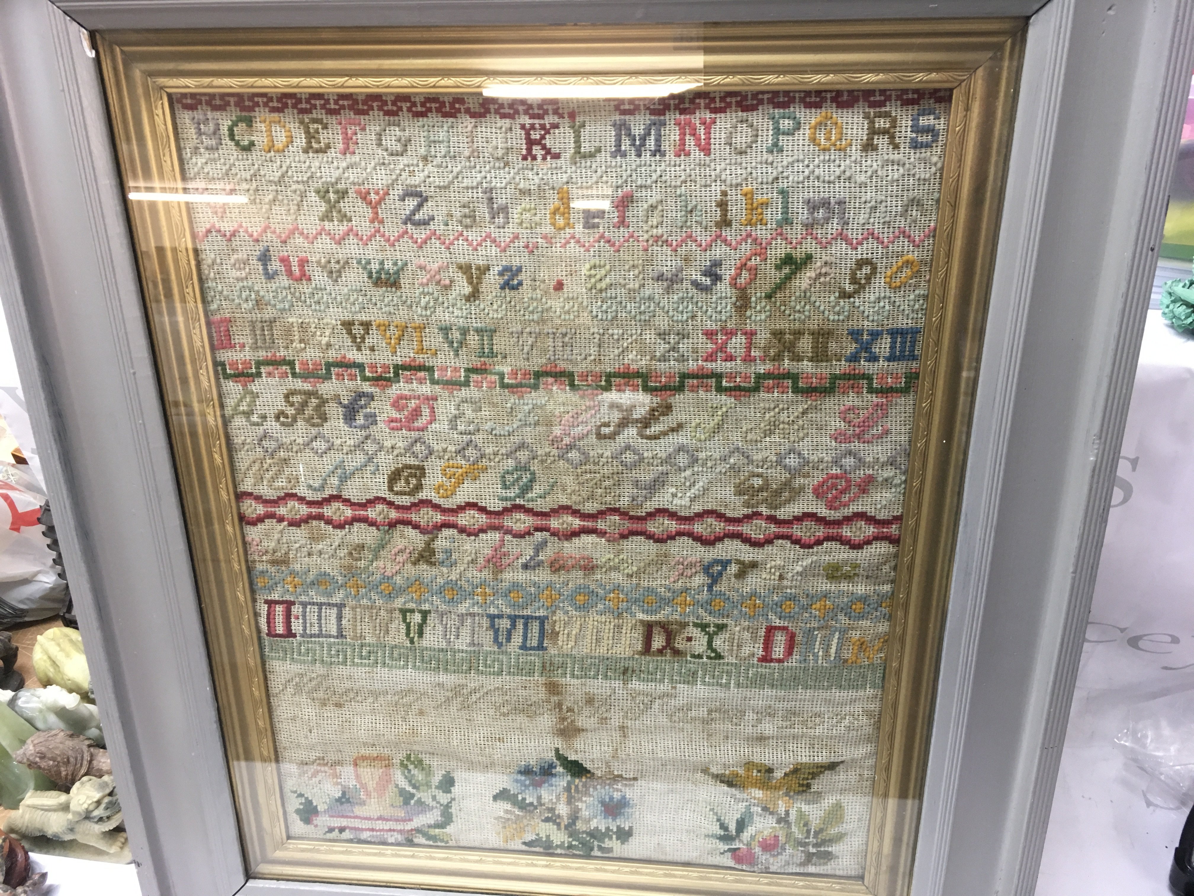 A Victorian needlework sampler in frame.