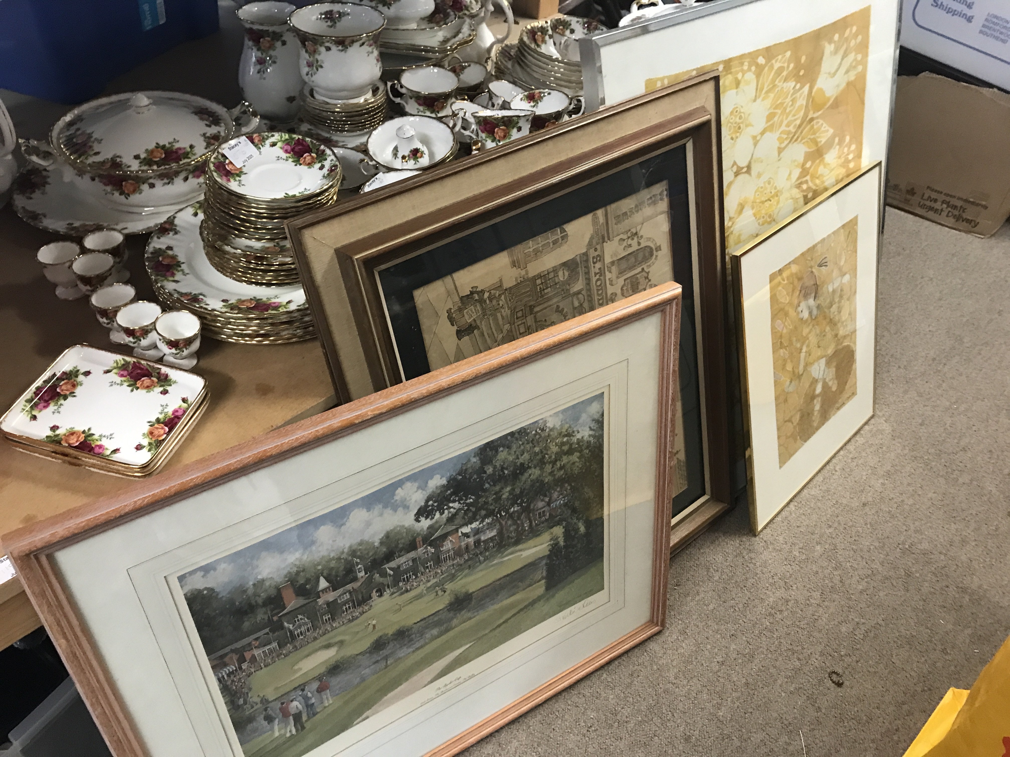 A collection of framed prints including Ryder Cup golf print by Sheree Valentine Daines, Victorian street scene cartoon sketch print, etc