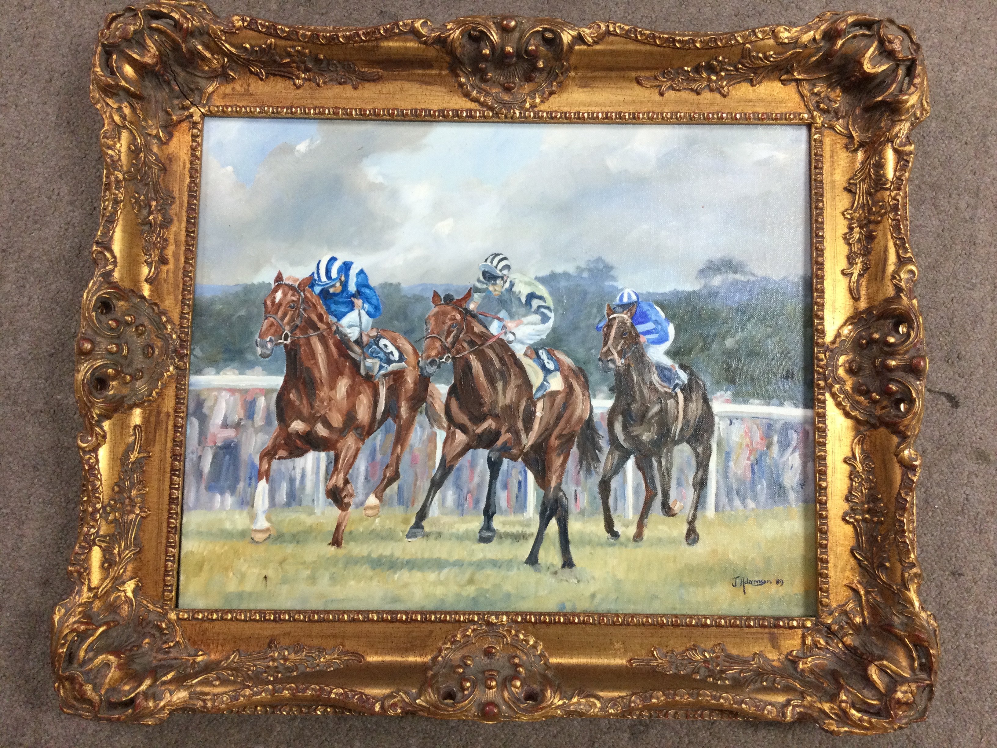 Three framed Horse Racing prints including signed limited edition 290/500 J Adamson, together with a framed oil on canvas depicting Jockeys and their Horses in a race, signed J Adamson 89