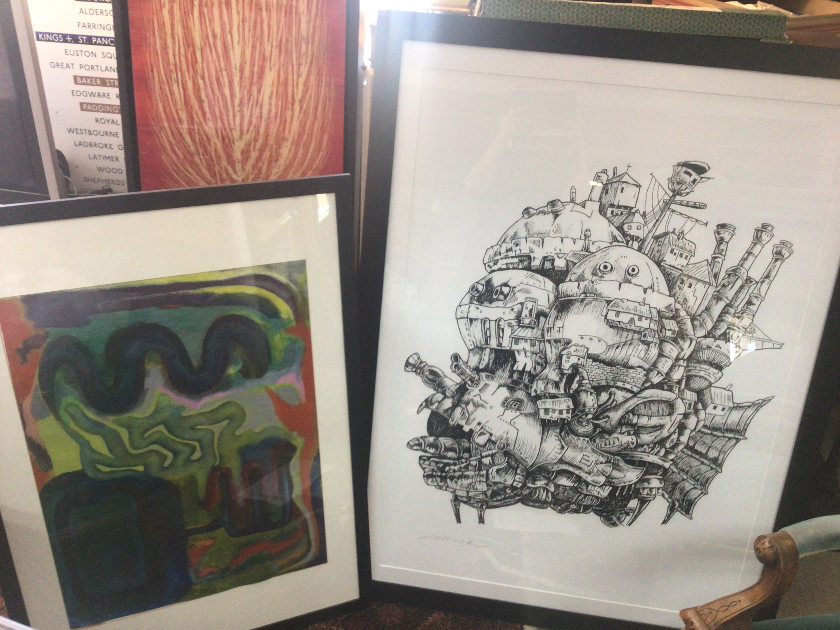 Two framed art works including an abstract painting and a large Howls moving castle anime print. Dimensions 65x106cm and 102x135cm This lot cannot be posted