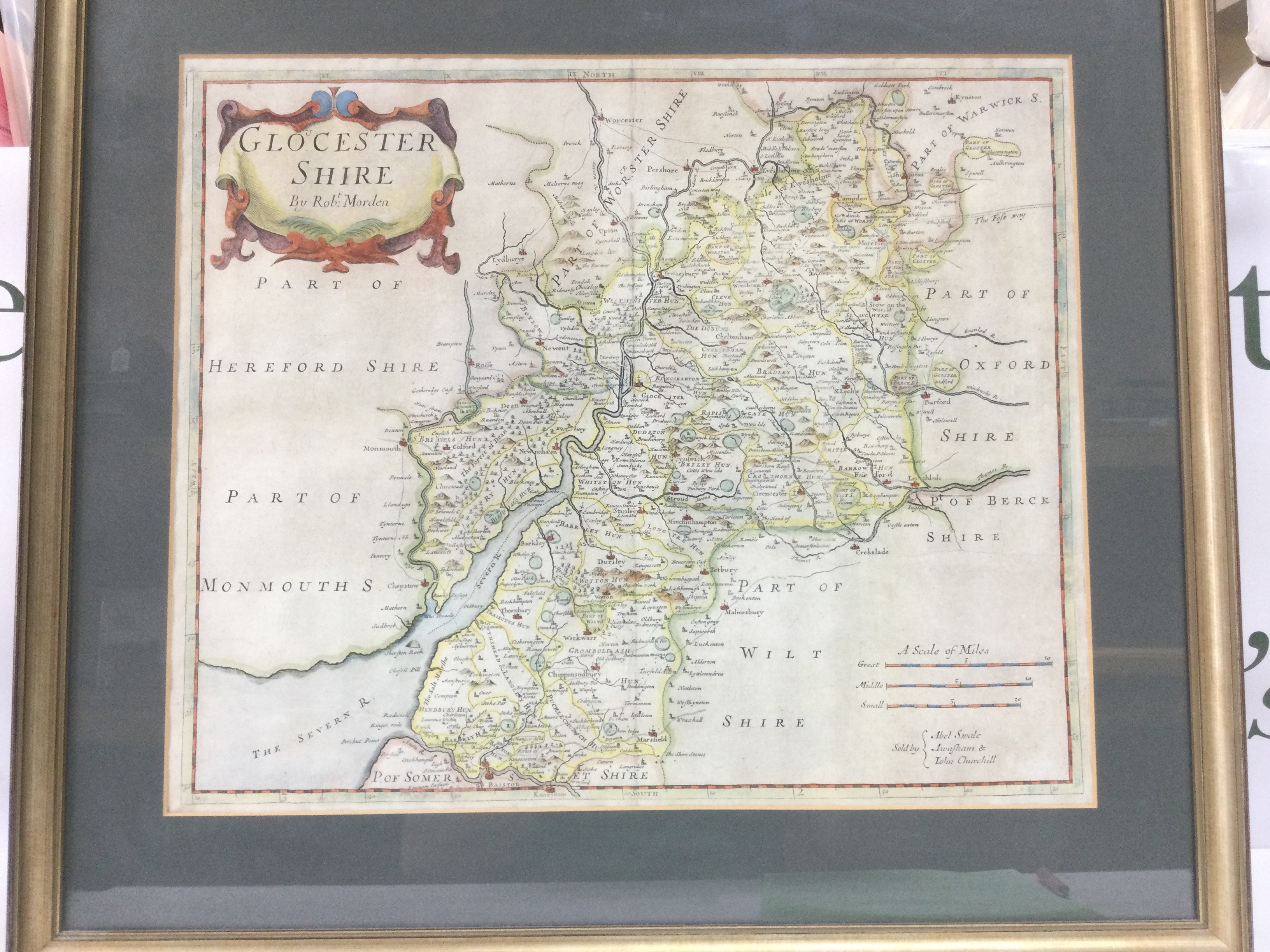 A framed and glazed Robert Morden map of Gloucestershire, approx 55cm x 49cm including frame. Shipping category D.