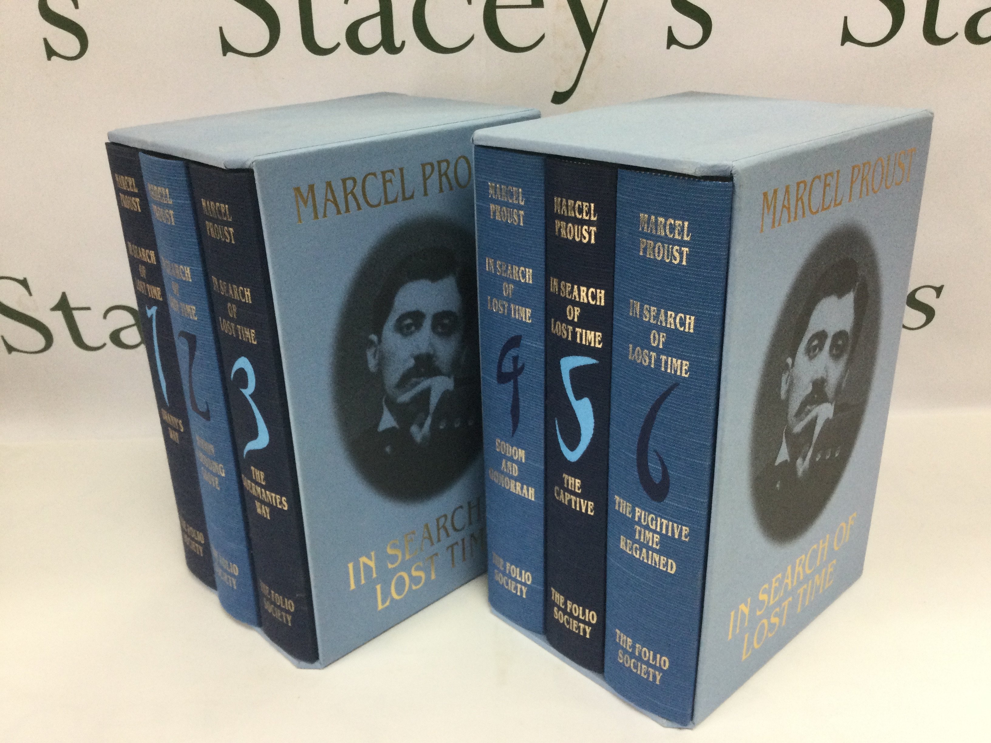 Two Folio Society three volume sets on the works of Marcel Proust. Shipping category C.