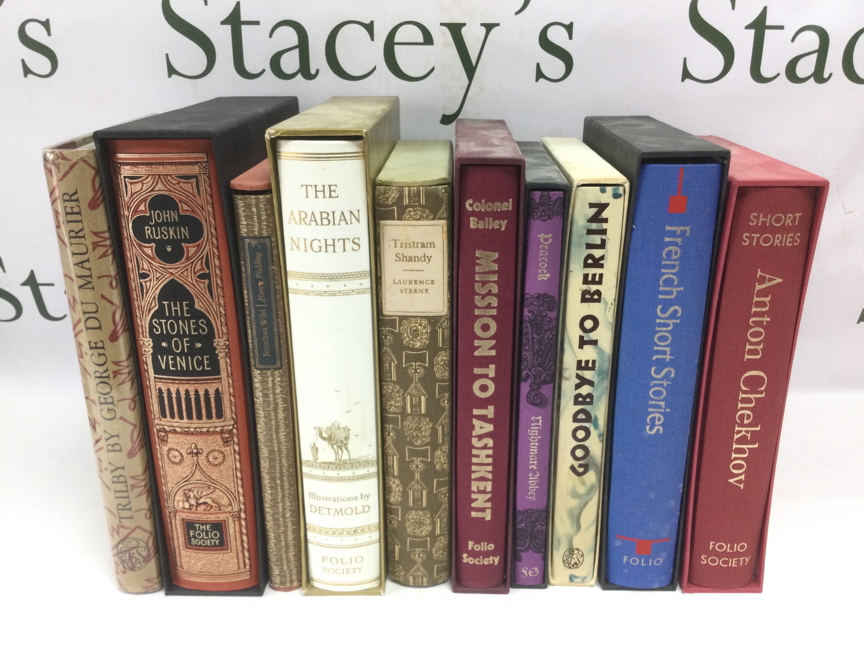 Ten Folio Society books comprising The Arabian Nights, Tristram Shandy, The Stones Of Venice and others. Shipping category D.