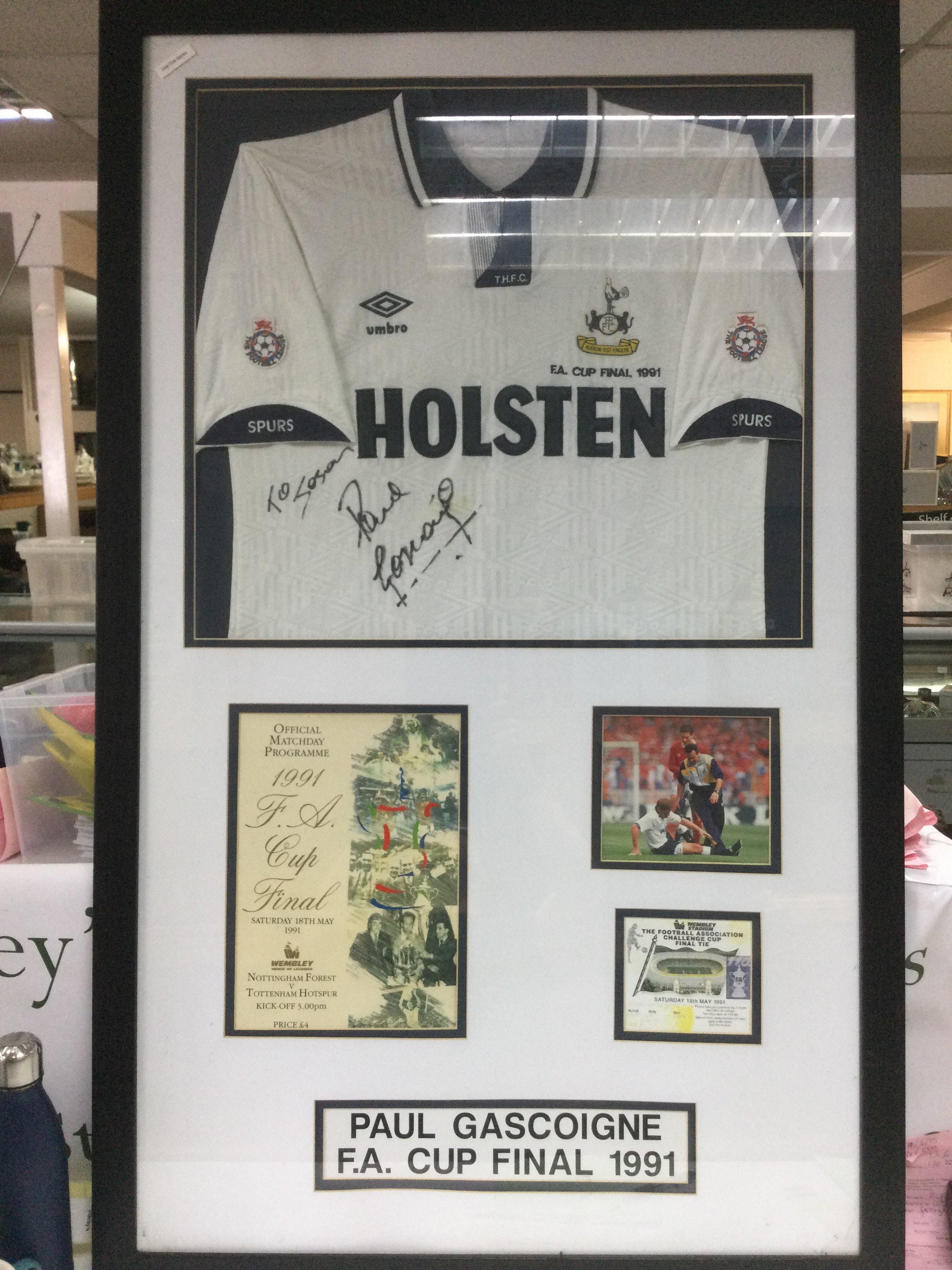 A framed and glazed 1991 FA Cup Final montage comprising a shirt signed by Paul Gascoigne, program and ticket, approx 73cm x 119cm. Shipping category D.