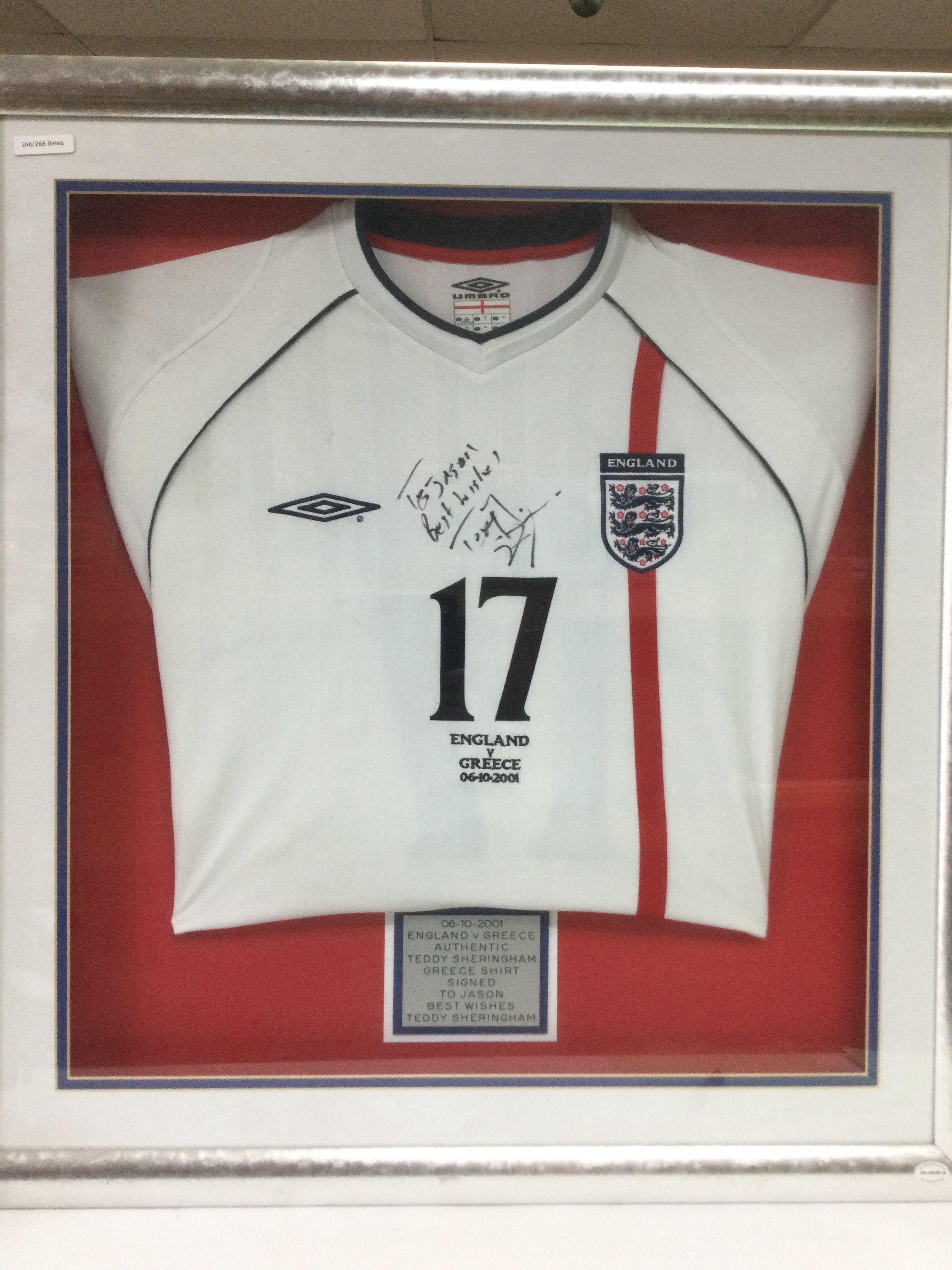 A framed and glazed 2001 England shirt signed by Teddy Sheringham, approx 73cm x 78cm. Shipping category D.