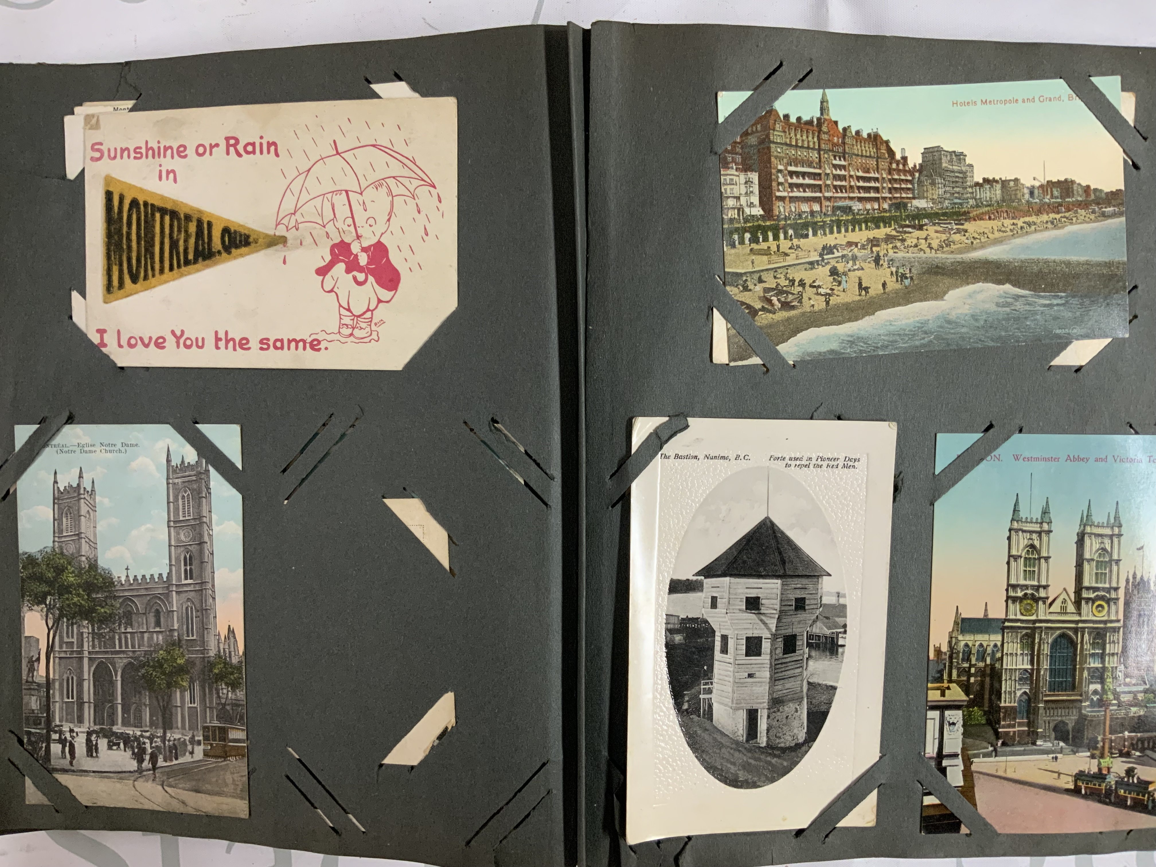 A 1920s postcard album together with a collection of loose postcards. (D)