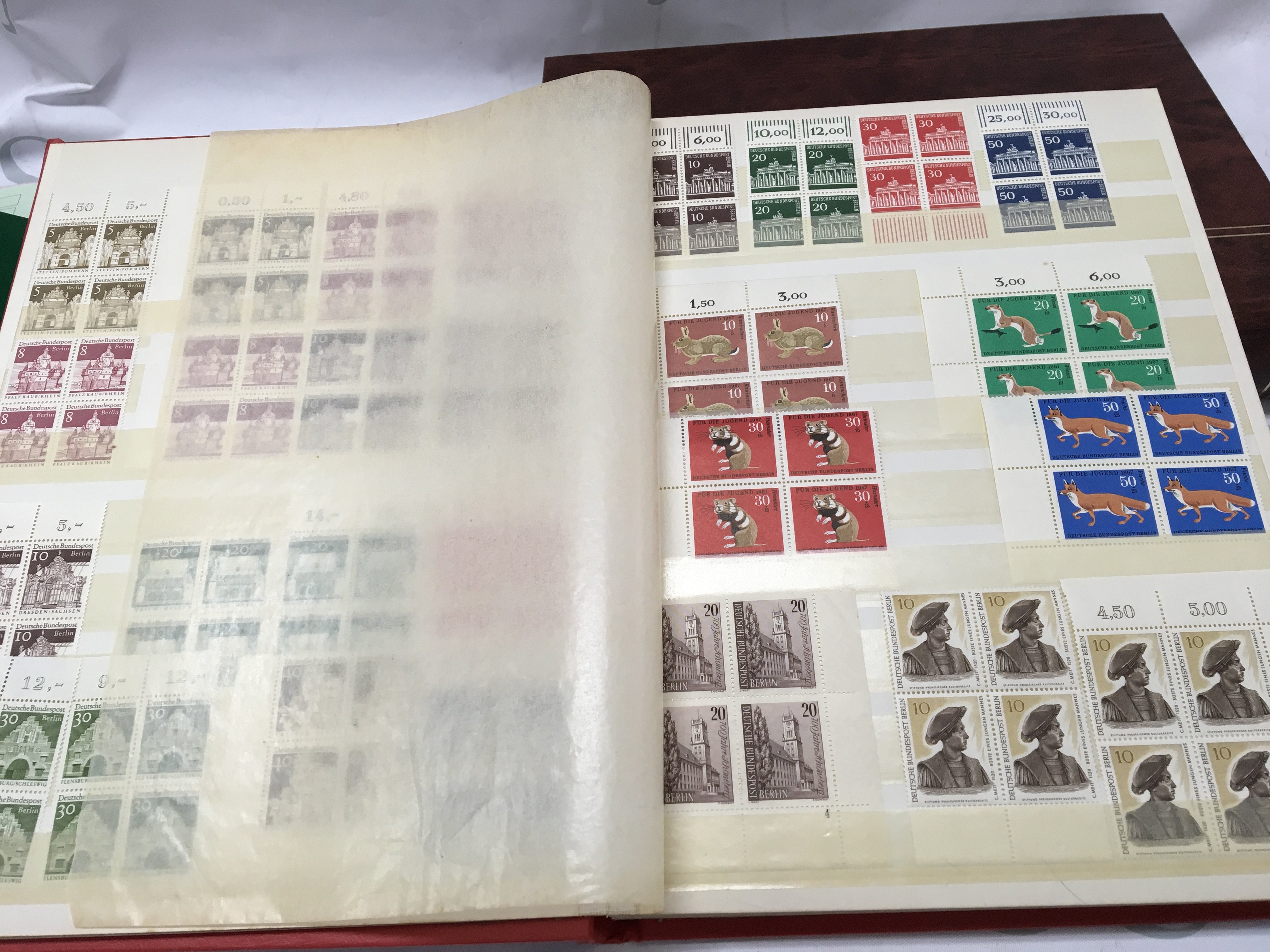 Three albums including two albums of German stamps and one of Swiss stamps, mainly unused of the Second half of the 20th century in blocks with margins . Postage category B