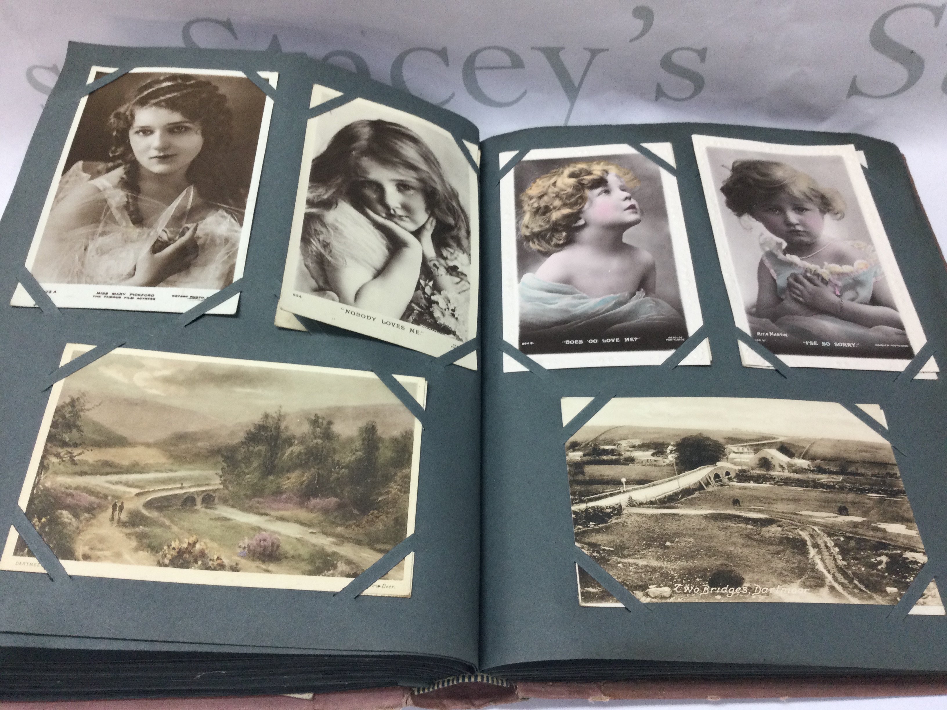 An album of post cards including Edwardian examples.