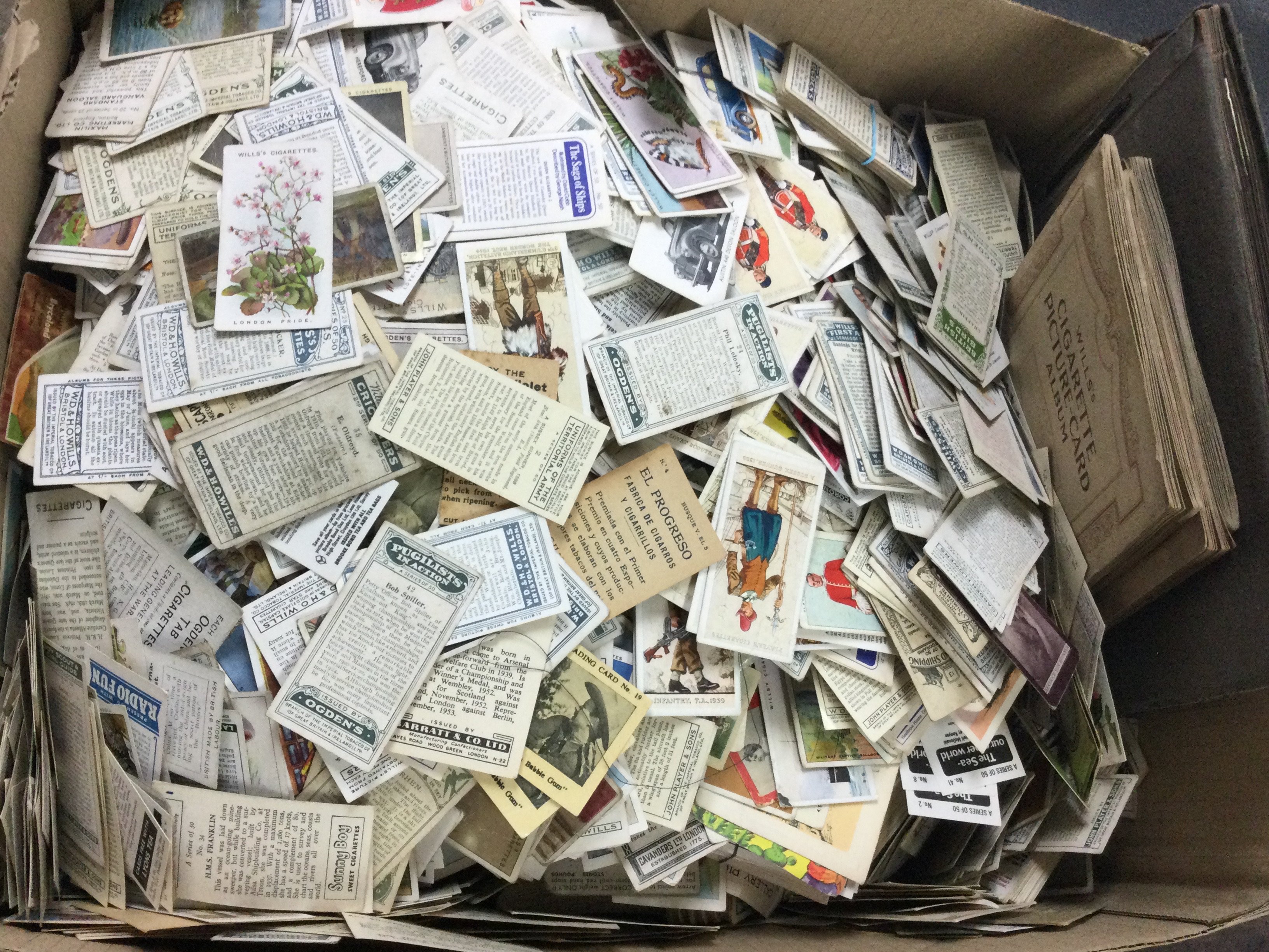 A large box of loose cigarette cards, including Gallahers, Wills, Ogdens, Players etc. postage category c