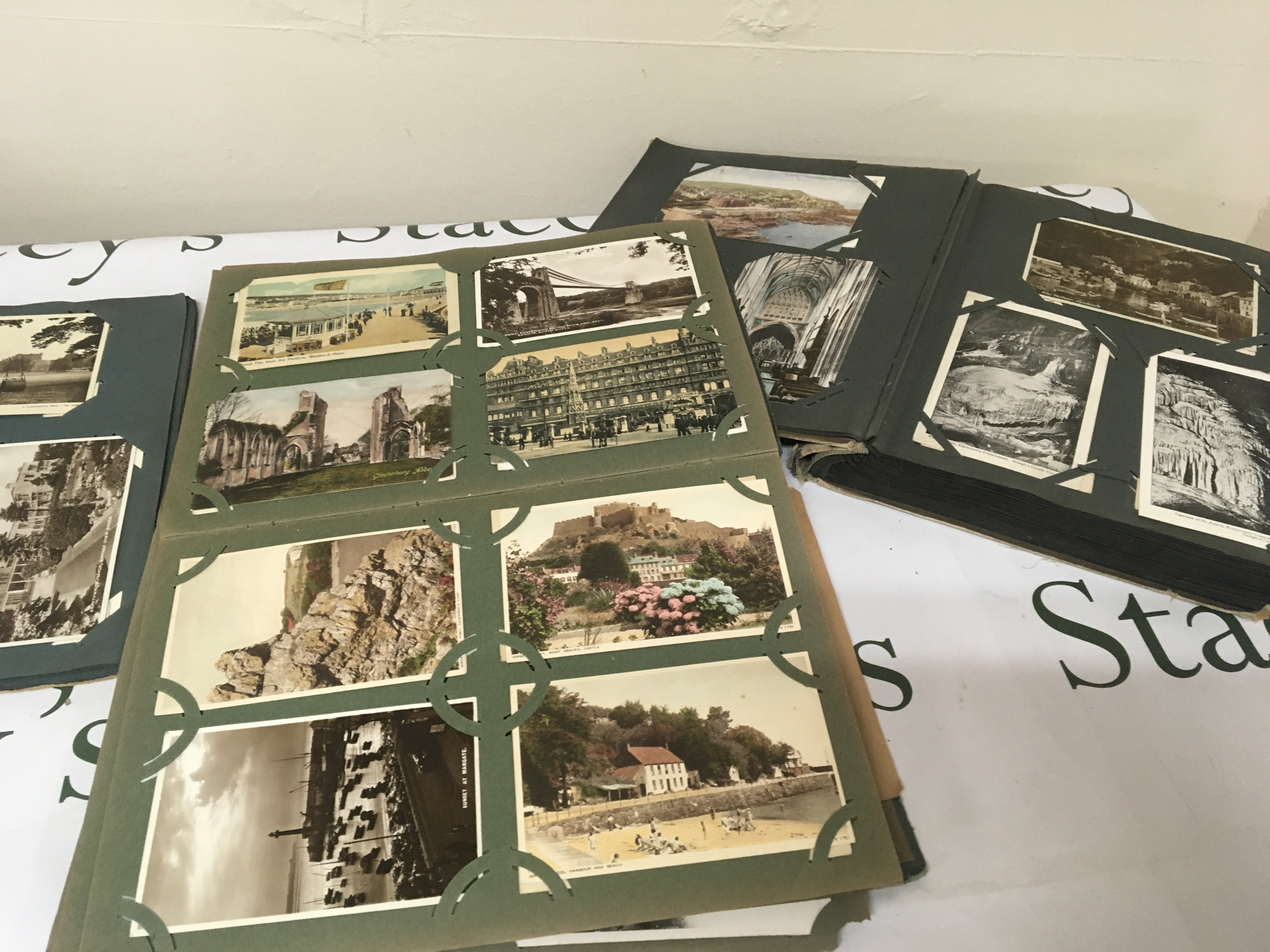 Three albums containing Vintage postcards including local Southend postcards and many others. (3)