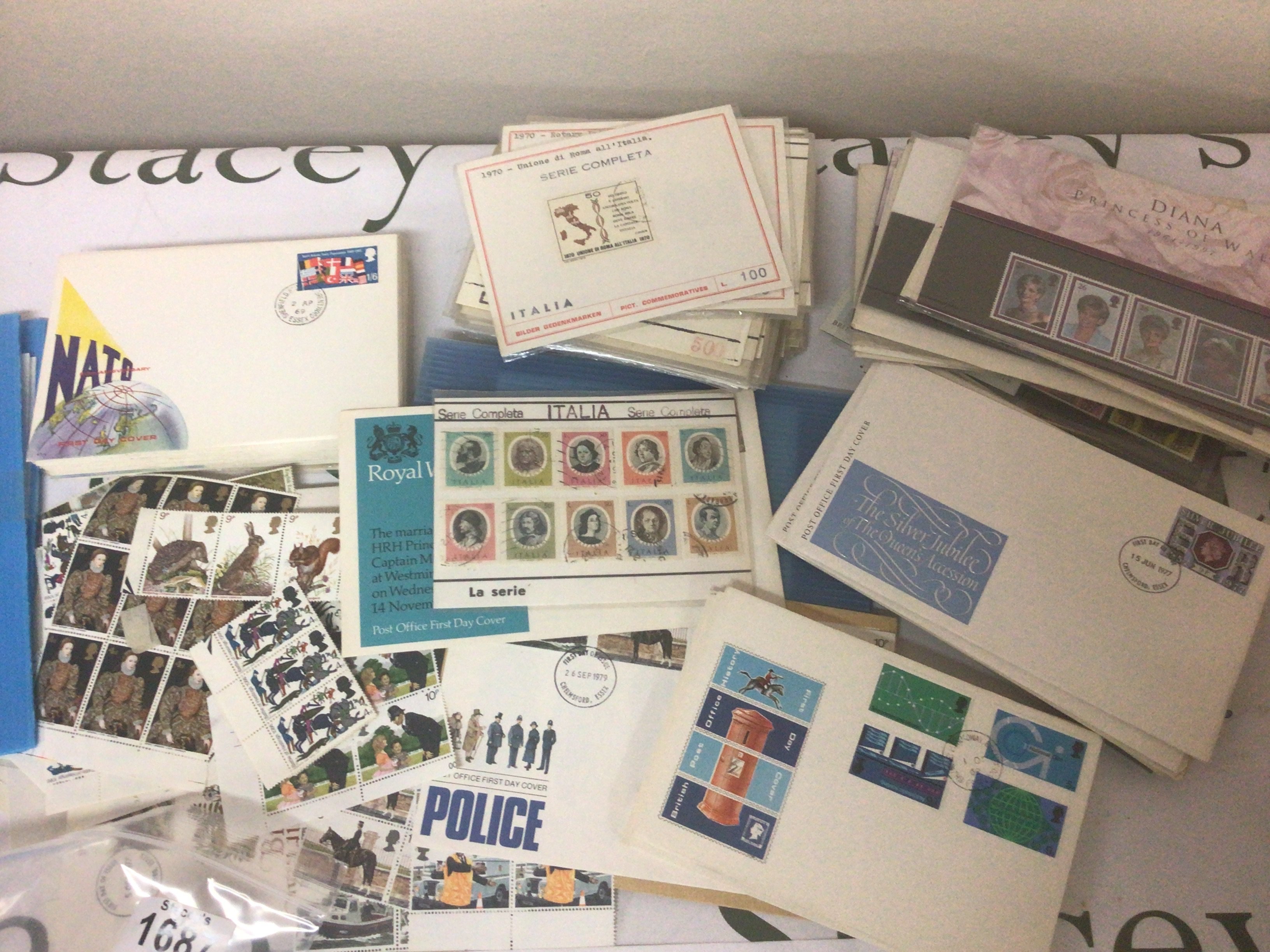 A collection of first day covers from the 1960s onwards Italian stamps British unused pictorial stamps presentation packs and others